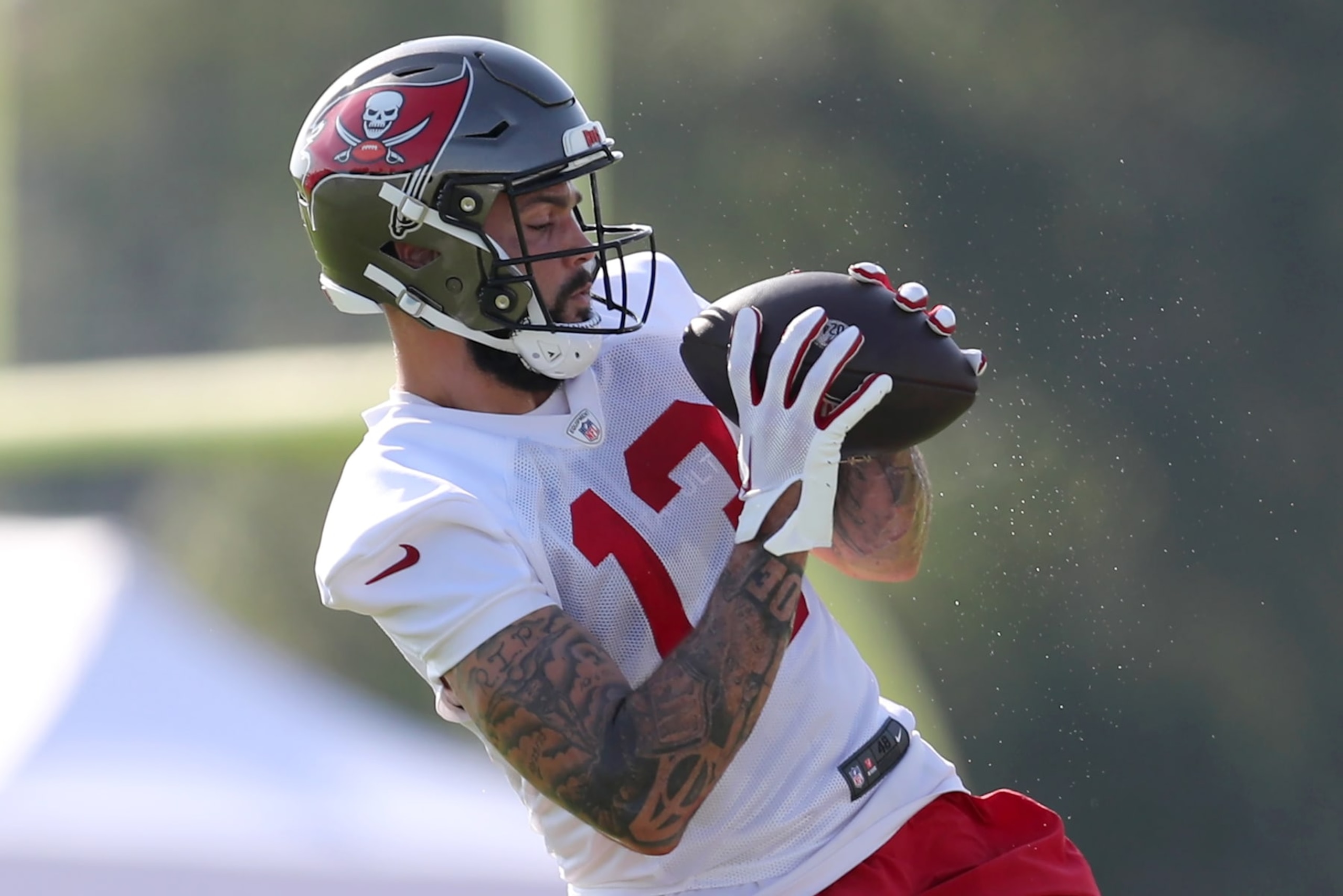TAMPA, FL - JUL 30: Tampa Bay Buccaneers Wide Receiver Mike Evans (13) goes thru a drill during the Tampa Bay Buccaneers Training Camp on July 30, 2023 at the AdventHealth Training Center at One Buccaneer Place in Tampa, Florida. (Photo by Cliff Welch/Icon Sportswire via Getty Images)