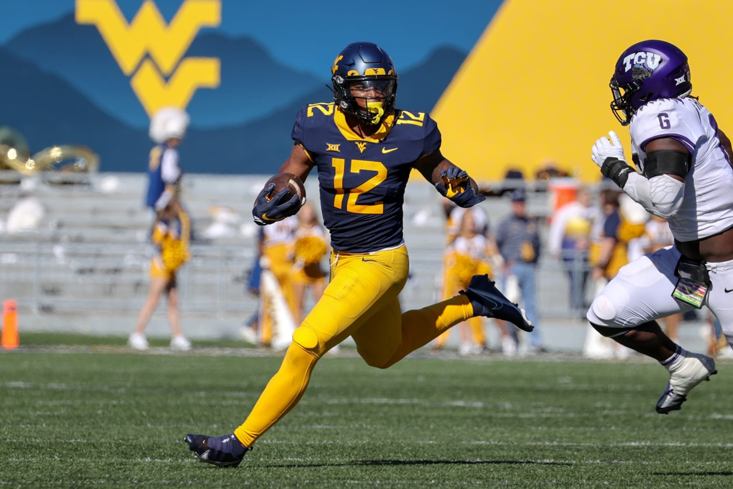 MORGANTOWN, WV - OCTOBER 29: West Virginia Mountaineers running back CJ Donaldson (12) runs the football during the second quarter of the college football game between the TCU Horned Frogs and the West Virginia Mountaineers on October 29, 2022, at Mountaineer Field at Milan Puskar Stadium in Morgantown, WV. (Photo by Frank Jansky/Icon Sportswire via Getty Images)