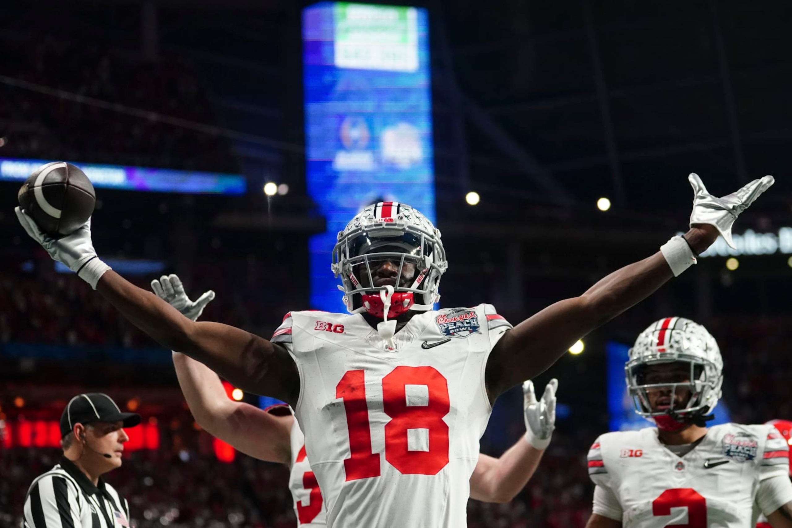 Ohio State wide receiver Marvin Harrison Jr. (18) celebrates hos touchdown catch against Georgia during the first half of the Peach Bowl NCAA college football semifinal playoff game, Saturday, Dec. 31, 2022, in Atlanta. (AP Photo/John Bazemore)