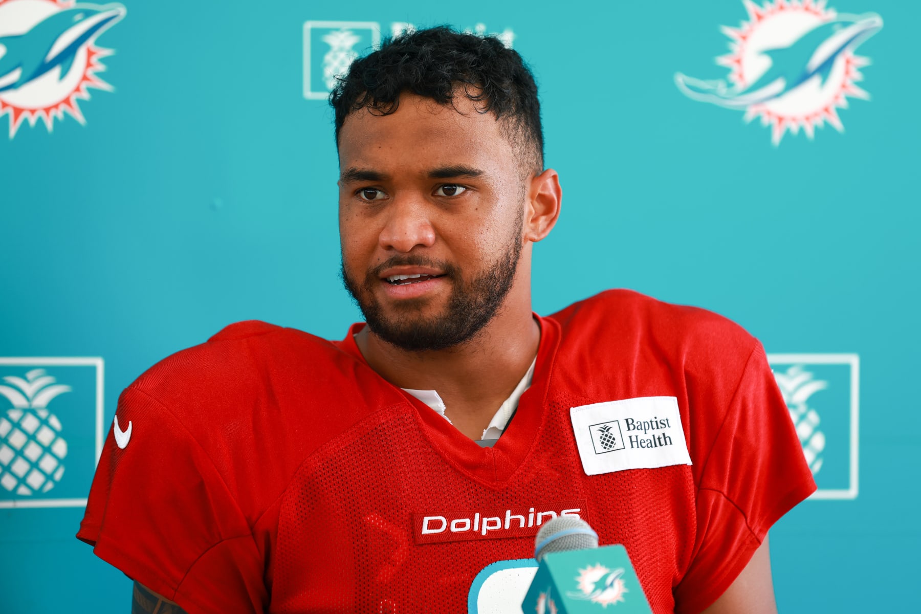 MIAMI GARDENS, FLORIDA - AUGUST 09: Tua Tagovailoa #1 of the Miami Dolphins speaks to the media after training camp practice with the Atlanta Falcons at Baptist Health Training Complex on August 09, 2023 in Miami Gardens, Florida. (Photo by Megan Briggs/Getty Images)