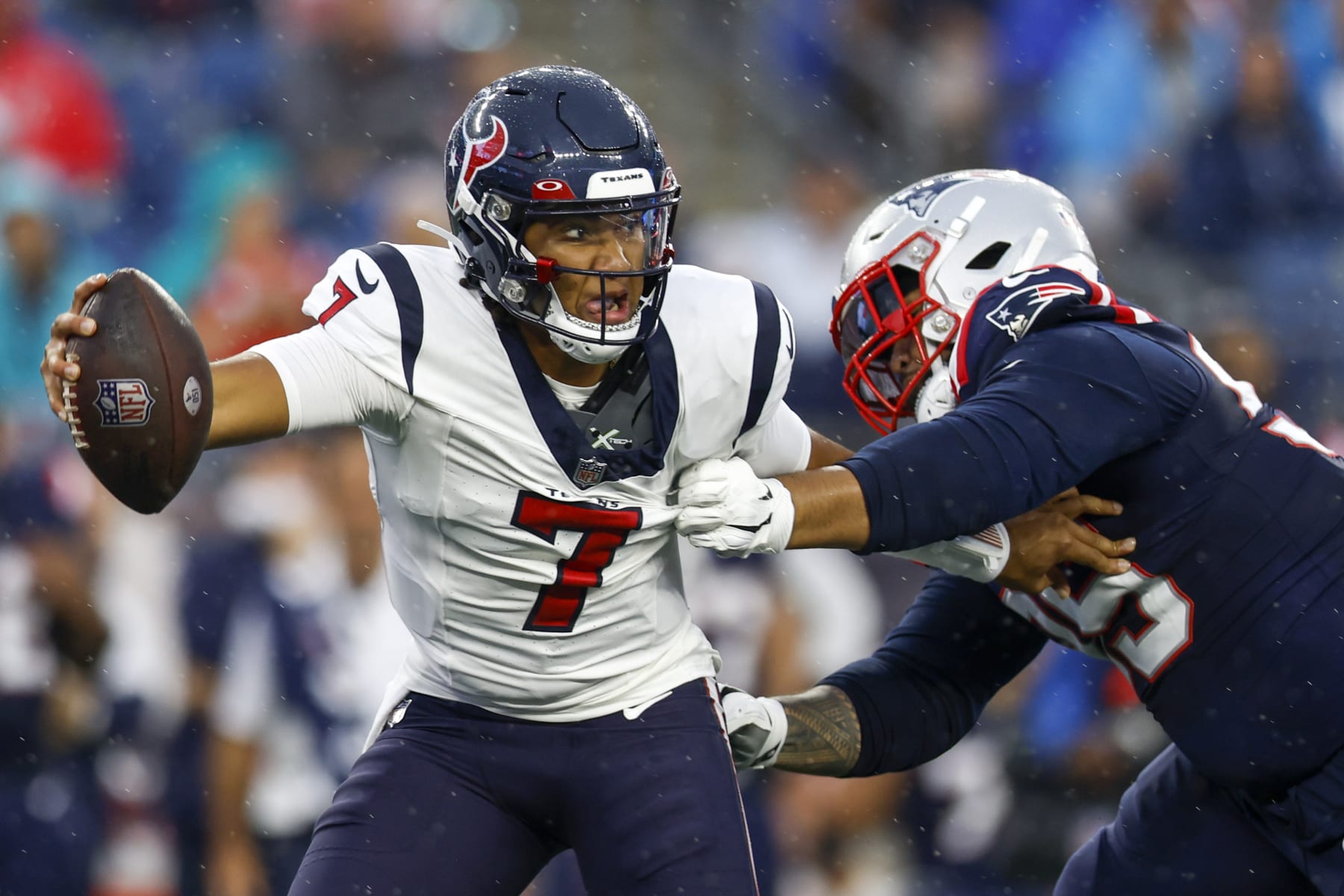 Houston Texans quarterback C.J. Stroud (7) is sacked by New England Patriots defensive tackle Daniel Ekuale (95) during the first half of an NFL pre-season football game, Thursday, Aug. 10, 2023, in Foxborough, Mass. (AP Photo/Greg M. Cooper)