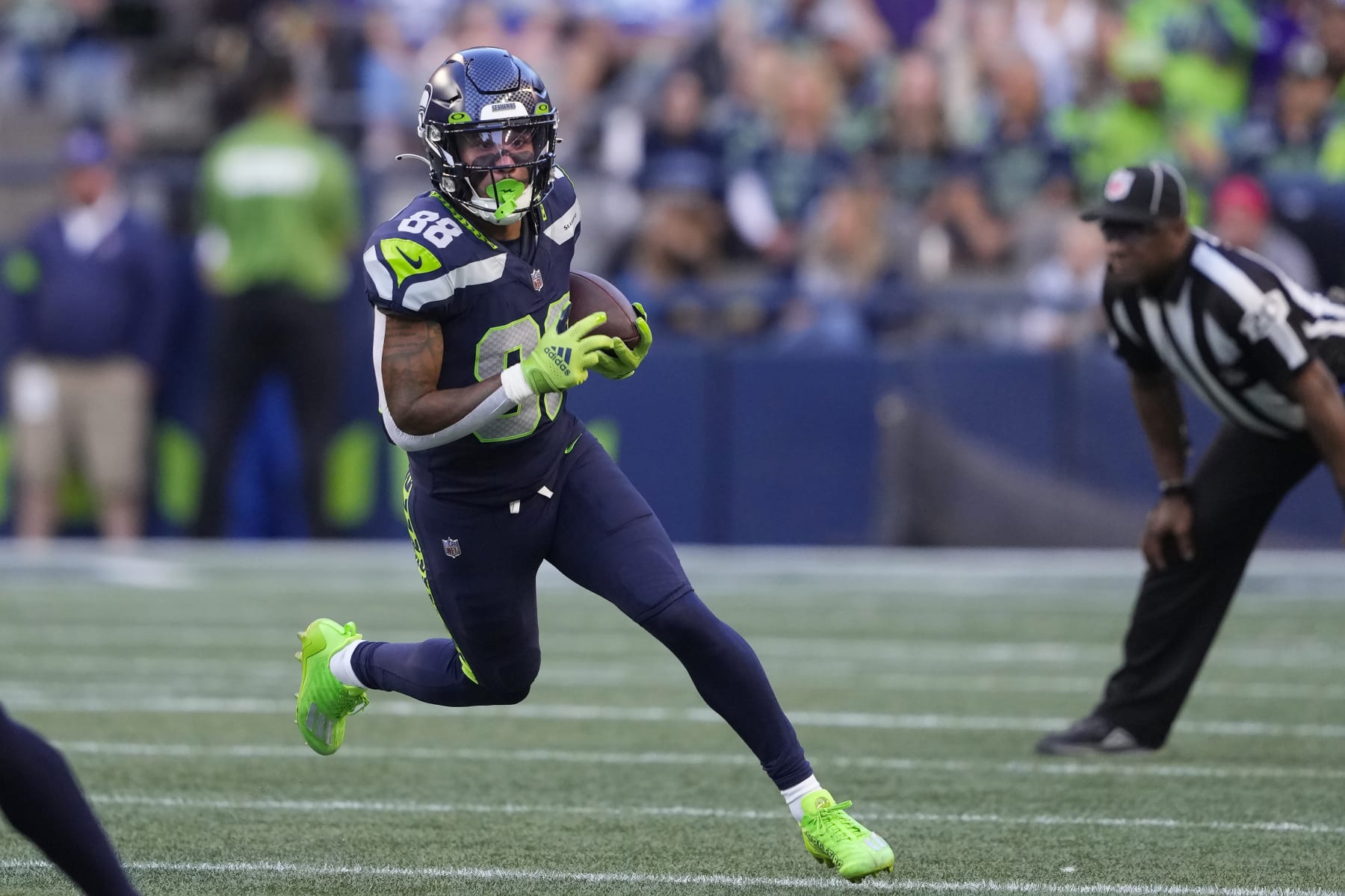Seattle Seahawks wide receiver Cade Johnson (88) runs against the Minnesota Vikings during the first half of an NFL preseason football game in Seattle, Thursday, Aug. 10, 2023. (AP Photo/Lindsey Wasson)