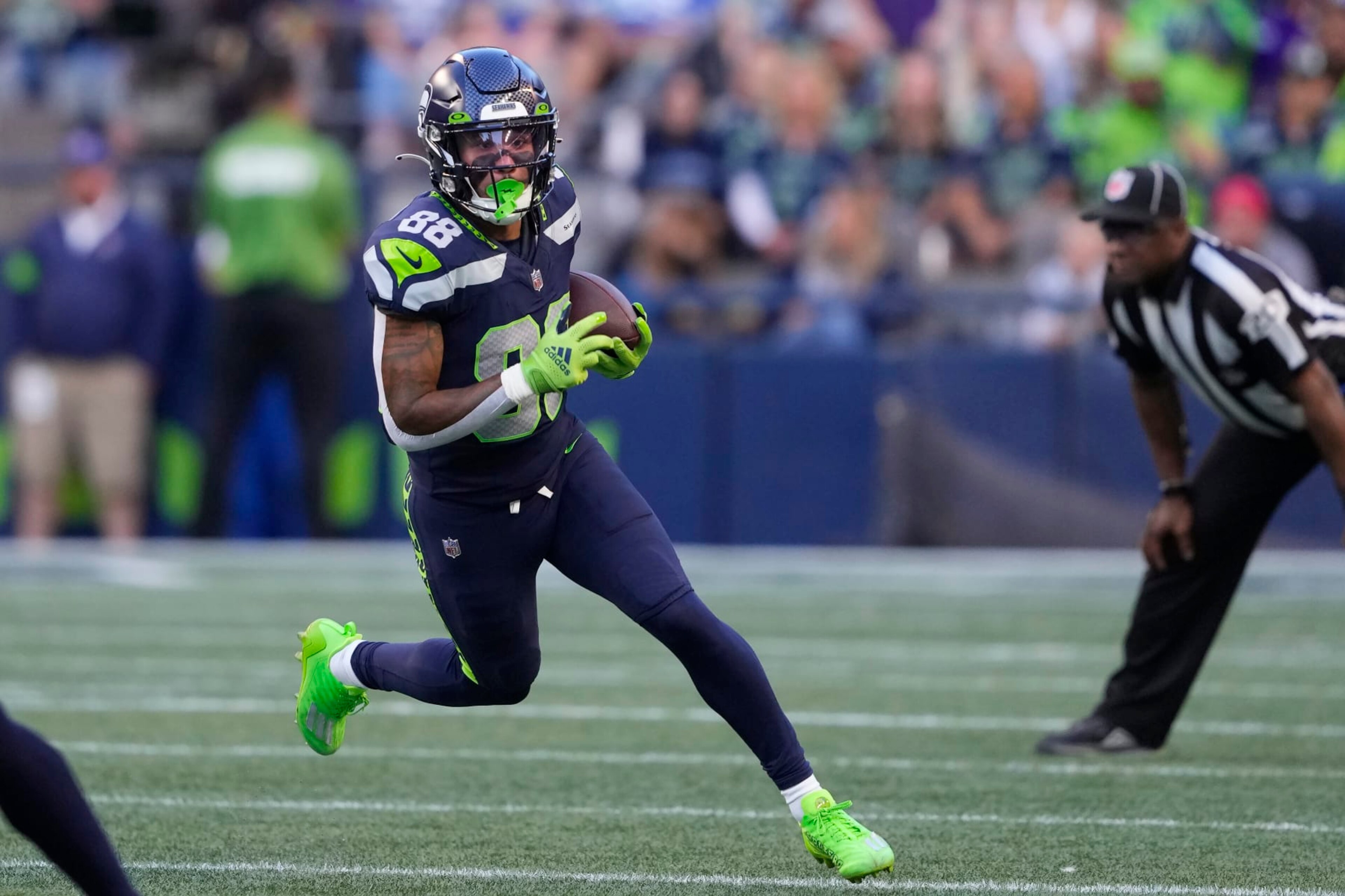 Seattle Seahawks wide receiver Cade Johnson (88) runs against the Minnesota Vikings during the first half of an NFL preseason football game in Seattle, Thursday, Aug. 10, 2023. (AP Photo/Lindsey Wasson)
