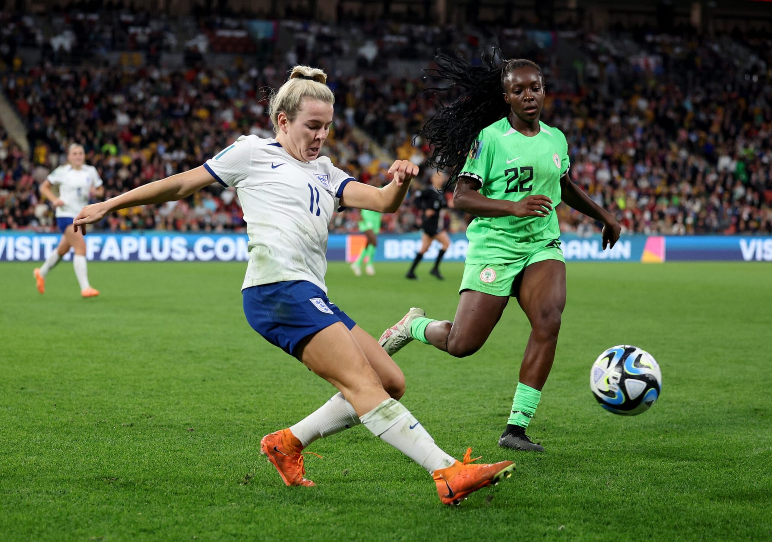 BRISBANE, AUSTRALIA - AUGUST 07:  Lauren Hemp of England passes the ball as Michelle Alozie of Nigeria defends during the FIFA Women's World Cup Australia & New Zealand 2023 Round of 16 match between England and Nigeria at Brisbane Stadium on August 07, 2023 in Brisbane, Australia. (Photo by Elsa - FIFA/FIFA via Getty Images)