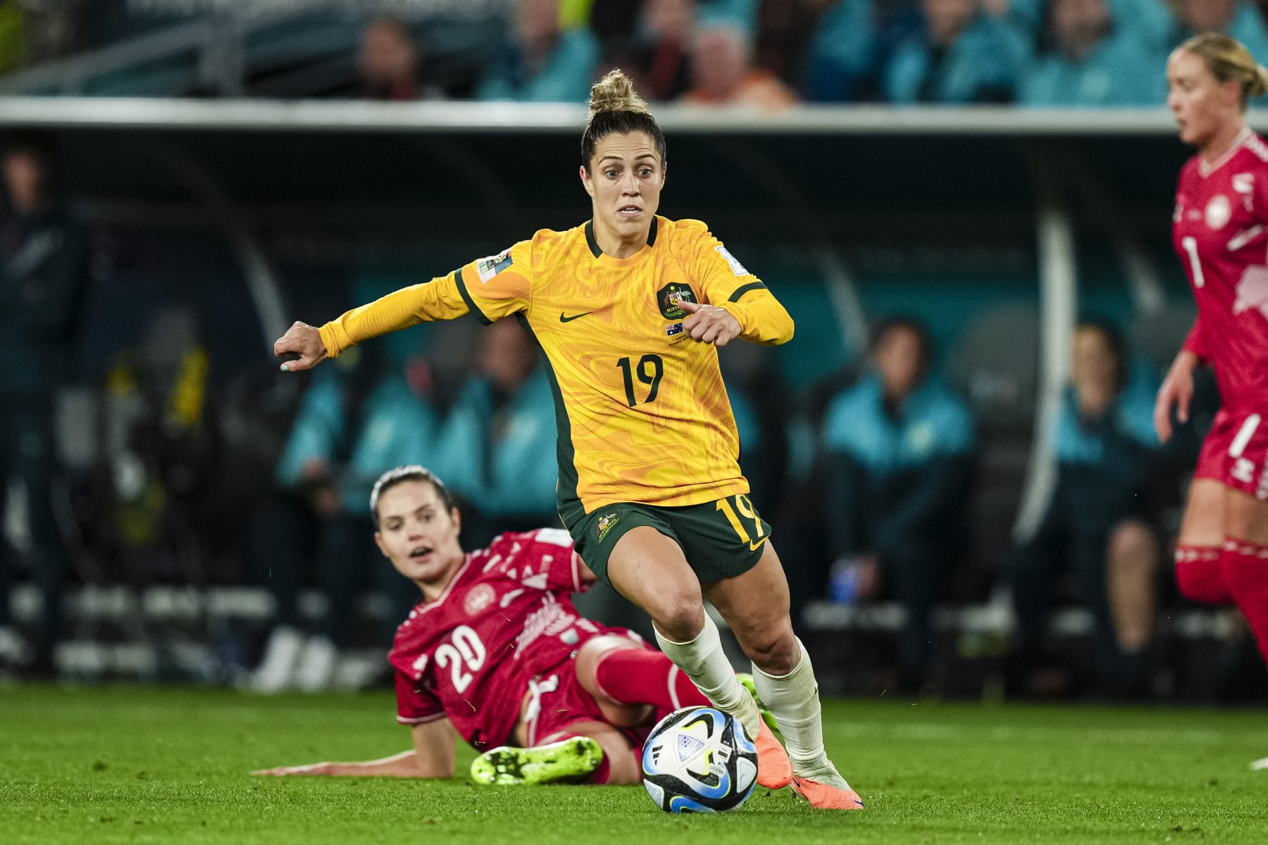 SYDNEY, AUSTRALIA - AUGUST 7: Katrina Gorry of Australia (R) dribbles Signe Bruun of Denmark (L) during the FIFA Women's World Cup Australia & New Zealand 2023 Round of 16 match between Australia and Runner Up Group D at Stadium Australia on August 7, 2023 in Sydney, Australia. (Photo by Daniela Porcelli/Eurasia Sport Images/Getty Images)