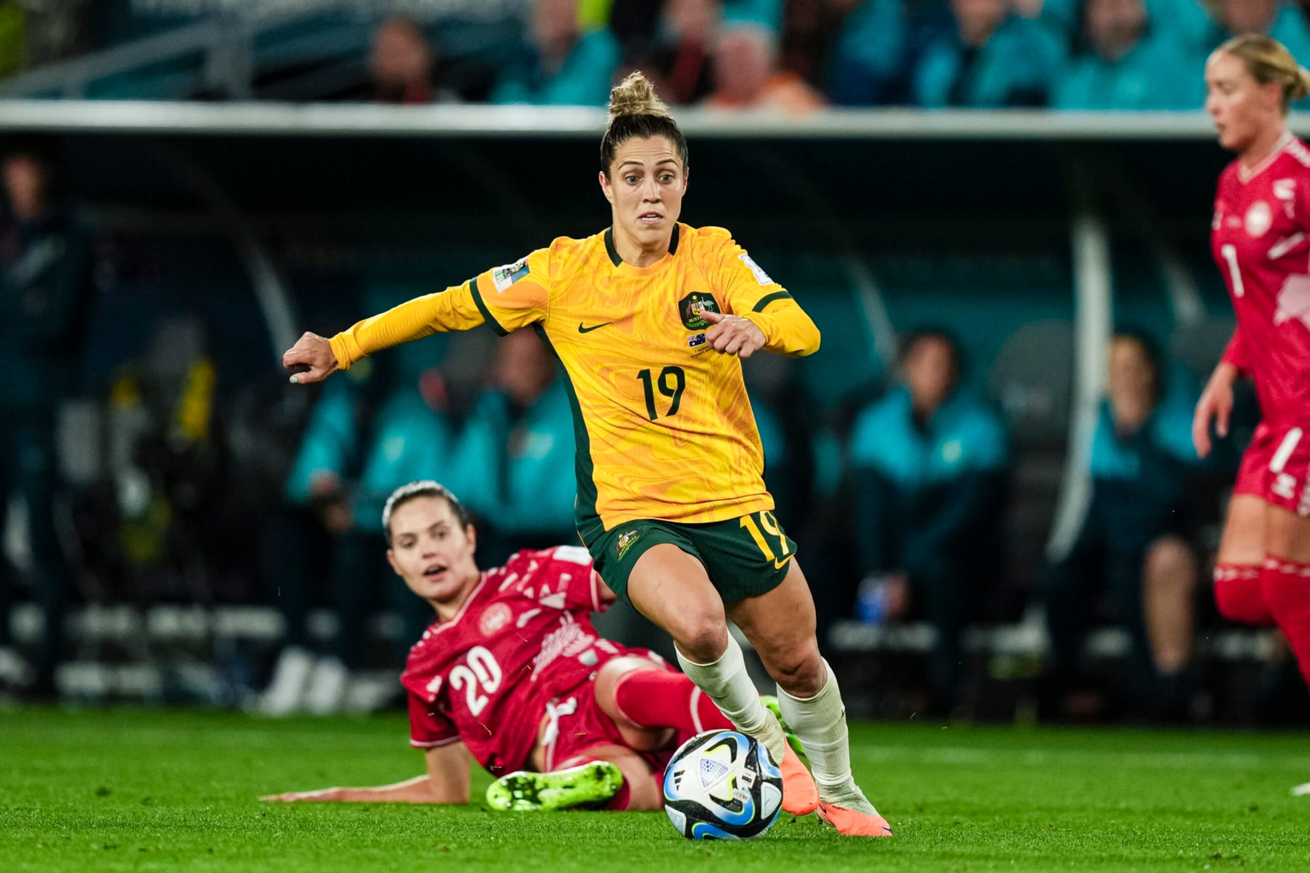 SYDNEY, AUSTRALIA - AUGUST 7: Katrina Gorry of Australia (R) dribbles Signe Bruun of Denmark (L) during the FIFA Women's World Cup Australia & New Zealand 2023 Round of 16 match between Australia and Runner Up Group D at Stadium Australia on August 7, 2023 in Sydney, Australia. (Photo by Daniela Porcelli/Eurasia Sport Images/Getty Images)