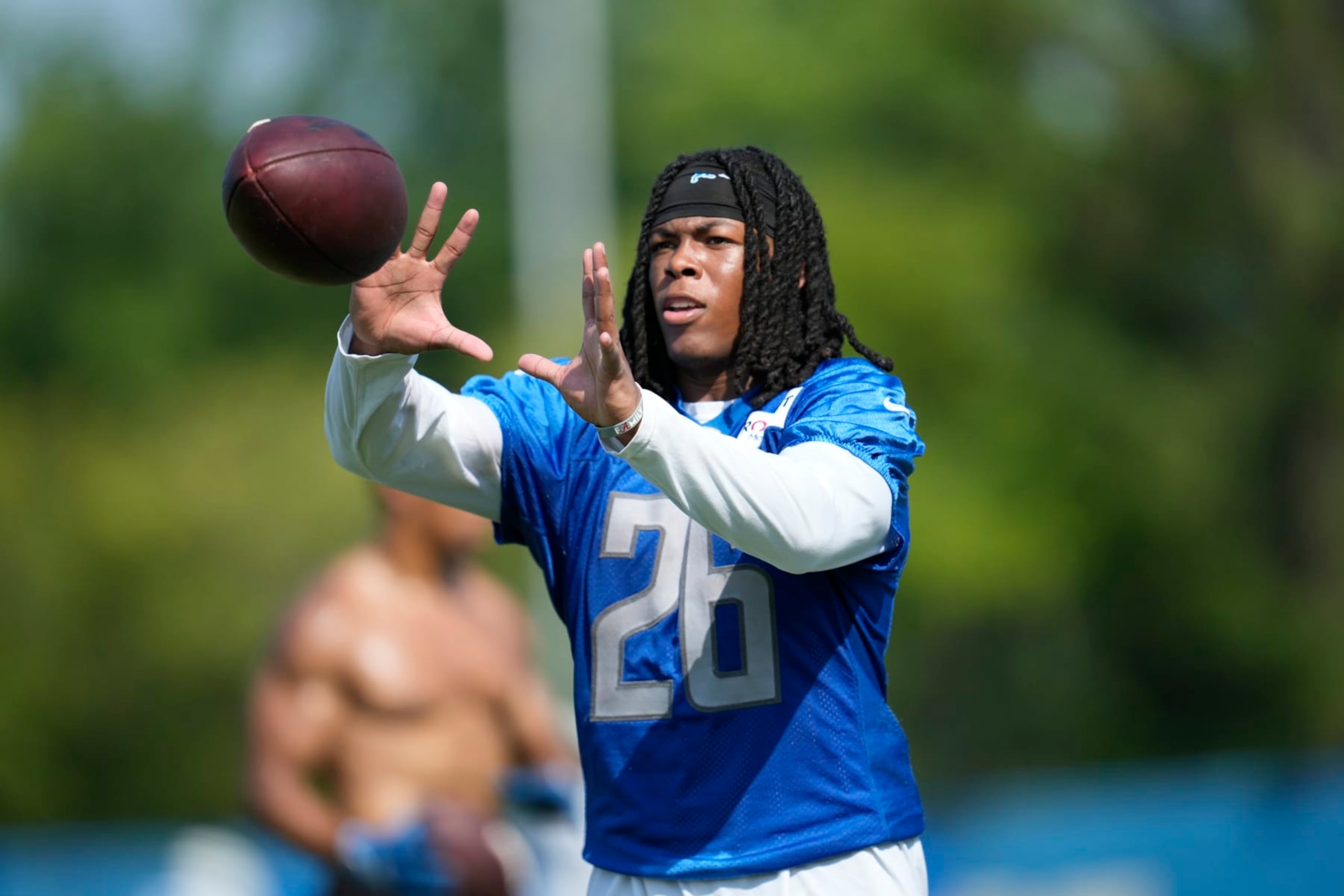 Detroit Lions running back Jahmyr Gibbs catches a pass during an NFL football practice in Allen Park, Mich., Monday, July 24, 2023. (AP Photo/Paul Sancya)
