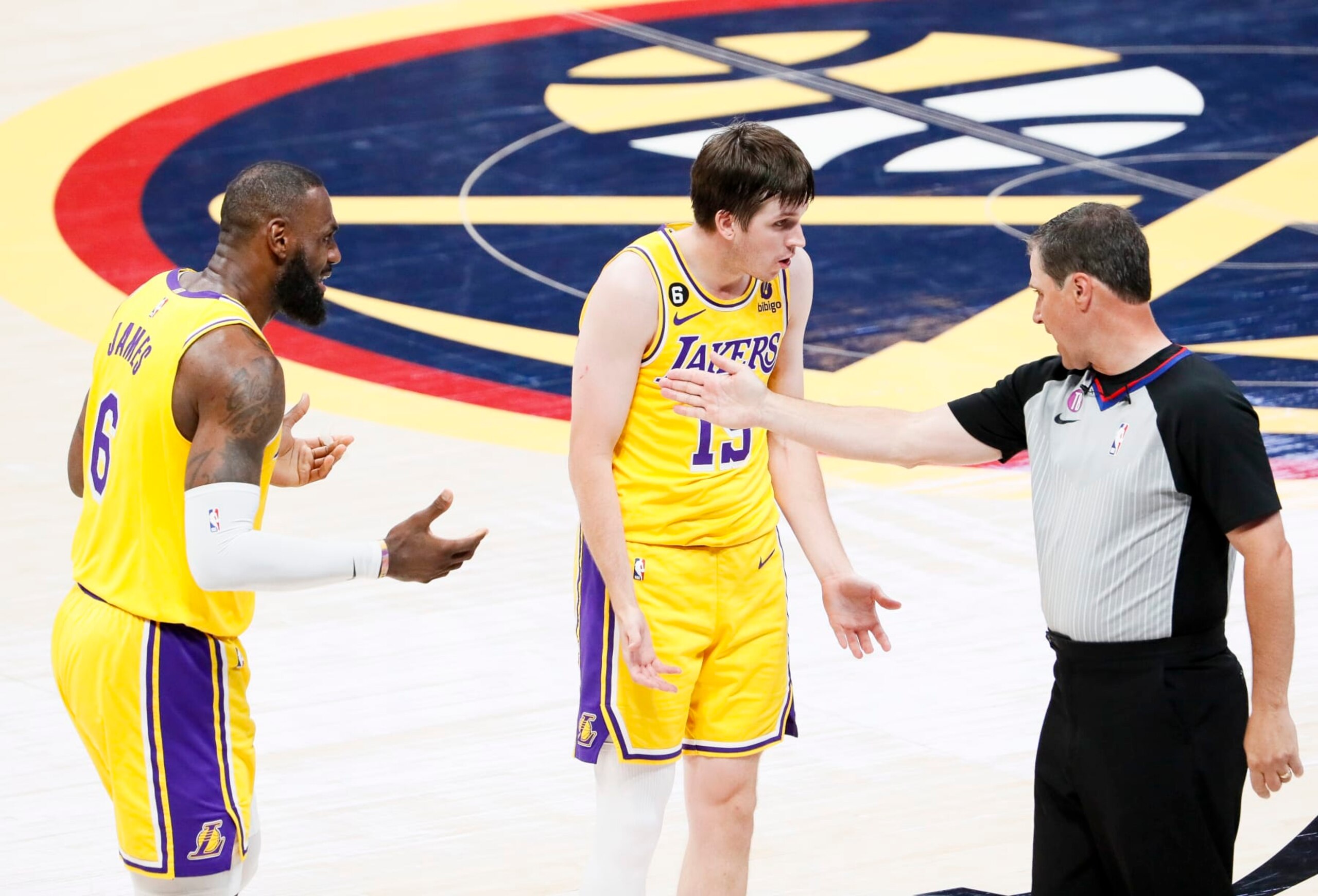 DENVER, CO - MAY 18: Los Angeles Lakers forward LeBron James, from left, and guard Austin Reaves talk with NBA referee David Guthrie during the second half of game two in the NBA Playoffs Western Conference Finals against the Denver Nuggets at Ball Arena on Thursday, May 18, 2023 in Denver, CO. (Robert Gauthier / Los Angeles Times via Getty Images)
