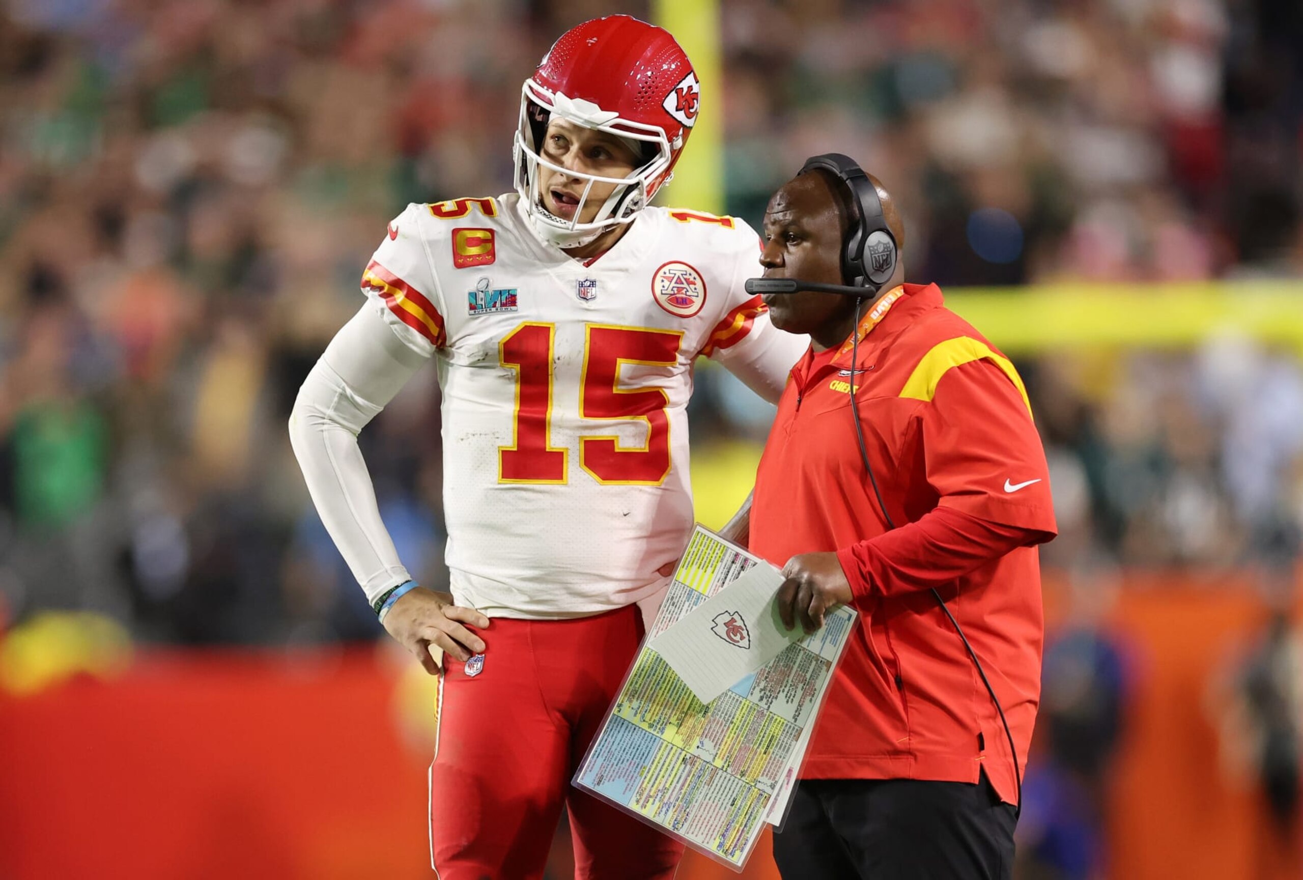 GLENDALE, ARIZONA - FEBRUARY 12: Patrick Mahomes #15 of the Kansas City Chiefs talks with offensive coordinator Eric Bieniemy during the fourth quarter against the Philadelphia Eagles in Super Bowl LVII at State Farm Stadium on February 12, 2023 in Glendale, Arizona. (Photo by Christian Petersen/Getty Images)