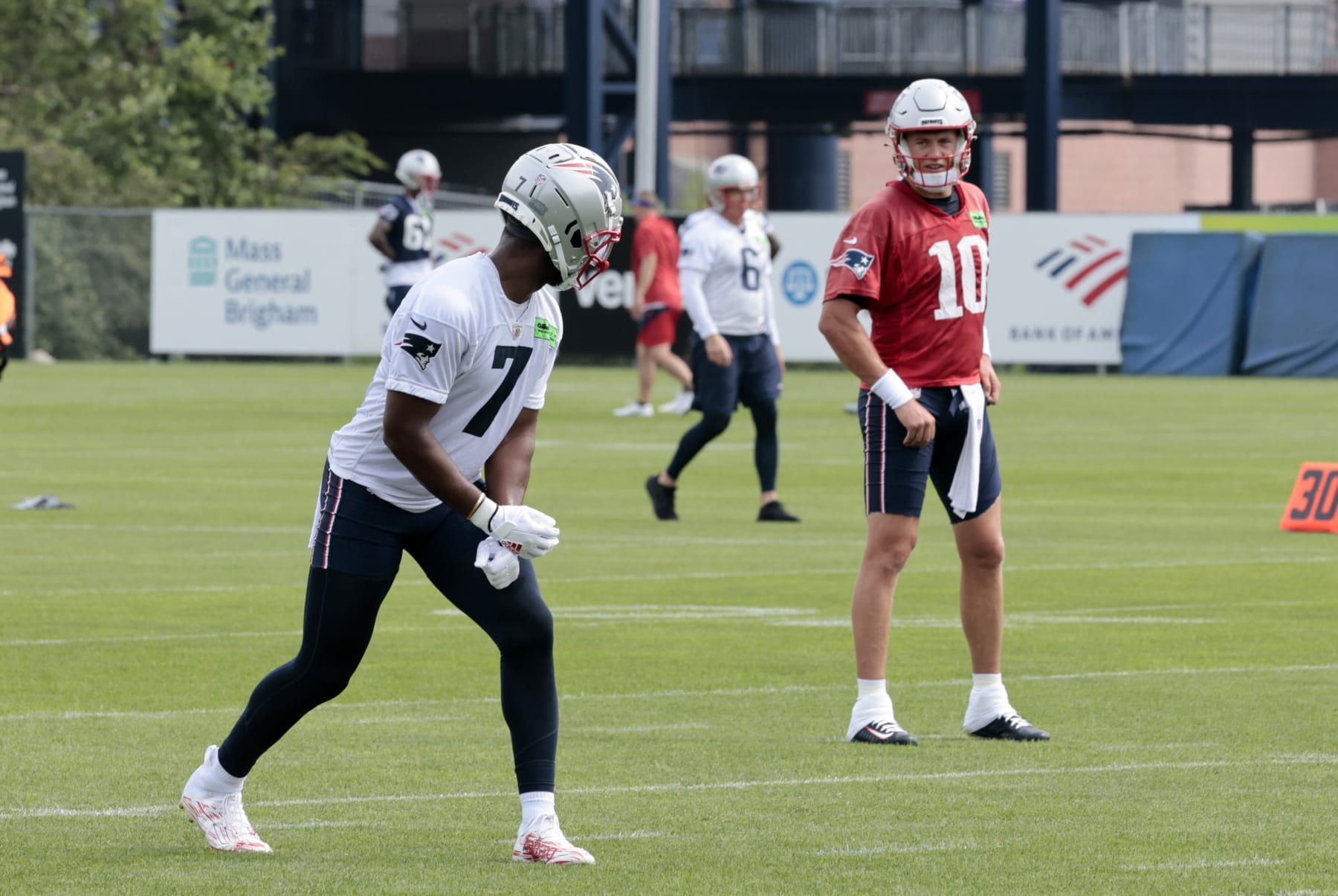 FOXBOROUGH, MA - JULY 27: New England Patriots wide receiver JuJu Smith-Schuster (7) checks with New England Patriots quarterback Mac Jones (10) on a play during New England Patriots Training Camp on July 27, 2023, at the Patriots Training Facility at Gillette Stadium in Foxborough, Massachusetts. (Photo by Fred Kfoury III/Icon Sportswire via Getty Images)