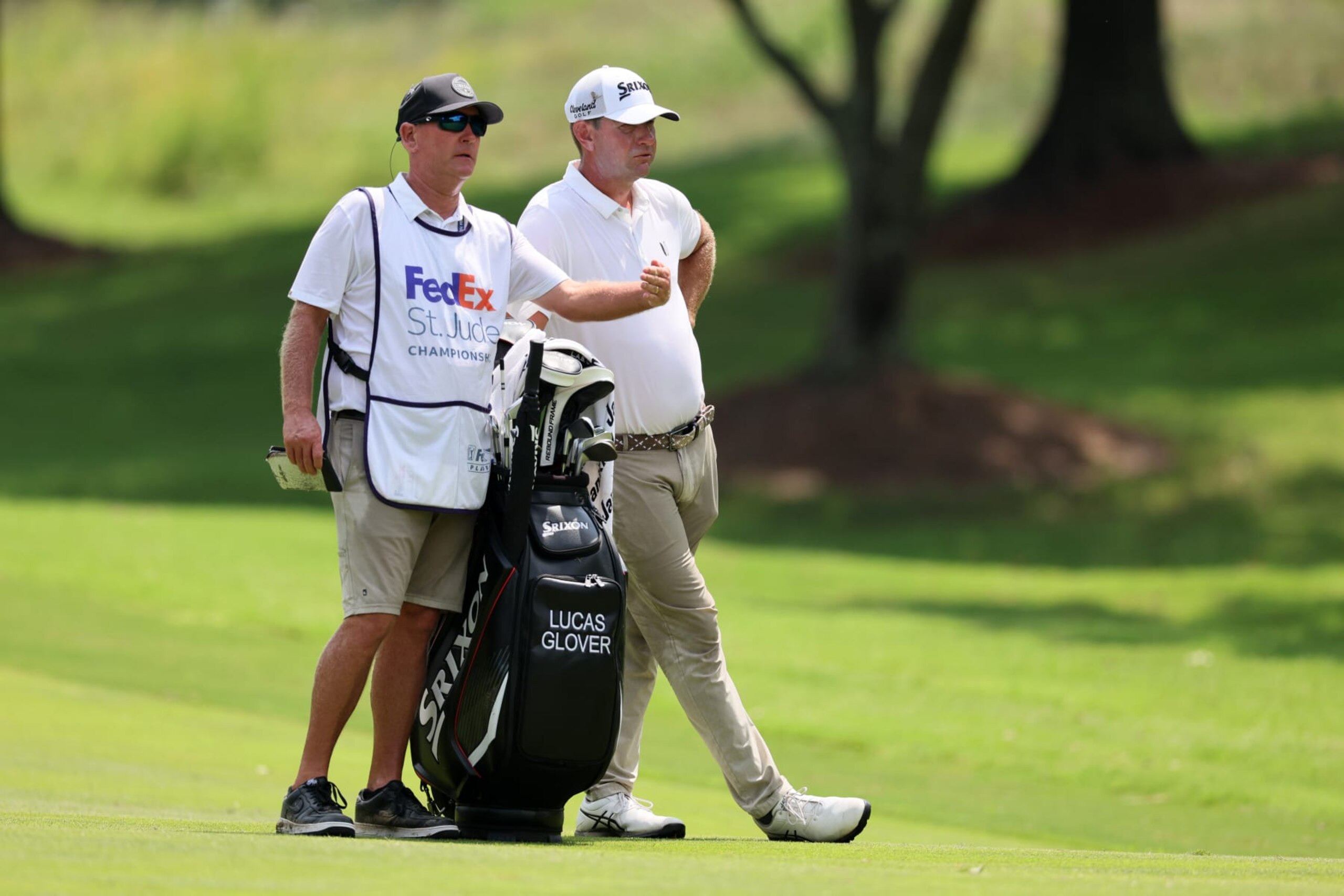 MEMPHIS, TENNESSEE - AUGUST 11: Lucas Glover of the United States and his caddie Tommy Lamb prepare to play a shot during the second round of the FedEx St. Jude Championship at TPC Southwind on August 11, 2023 in Memphis, Tennessee. (Photo by Andy Lyons/Getty Images)