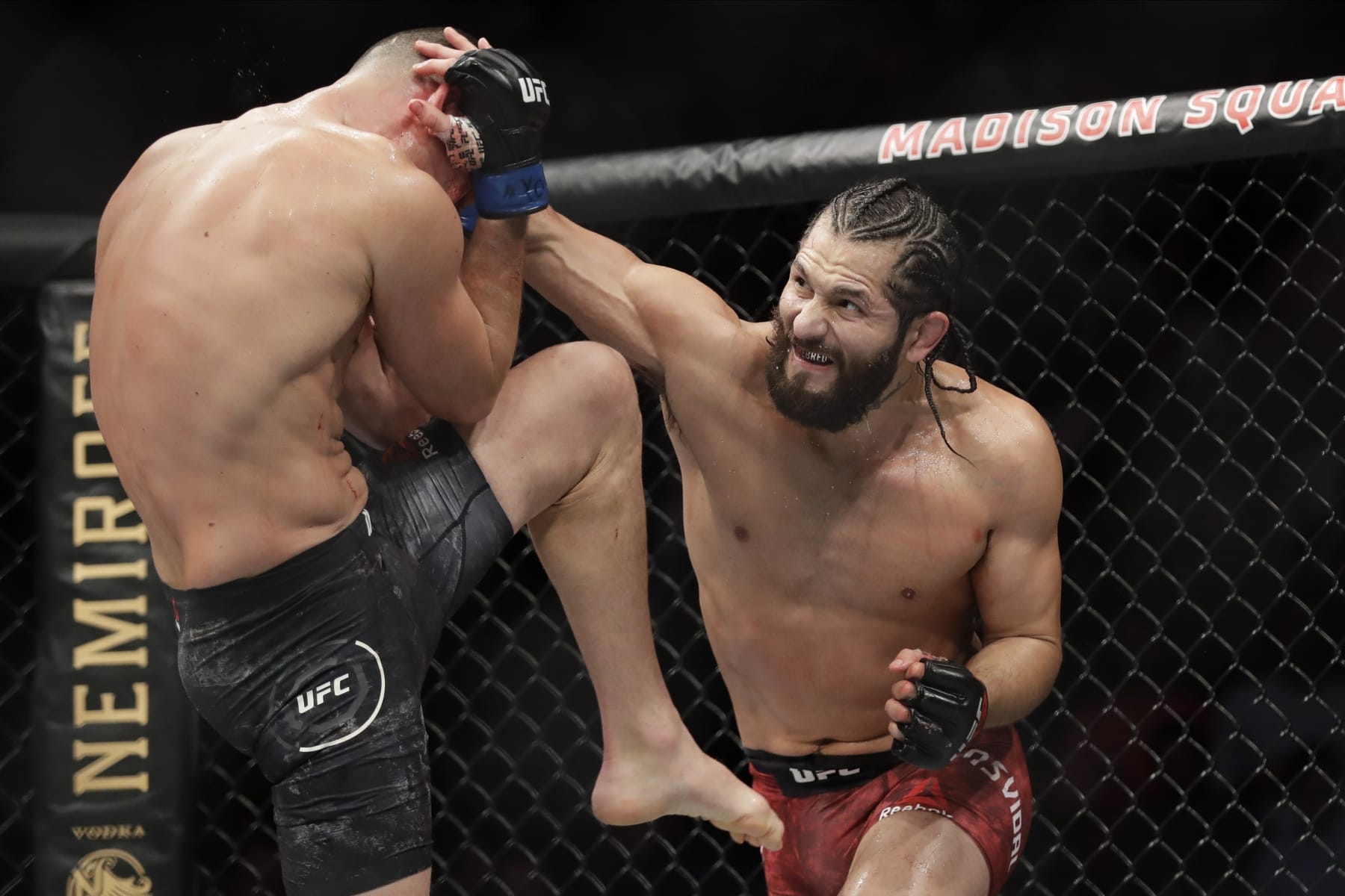 Jorge Masvidal, right, punches Nate Diaz during the second round of a welterweight mixed martial arts bout at UFC 244 early Sunday, Nov. 3, 2019, in New York. Masvidal won in the fourth round. (AP Photo/Frank Franklin II)
