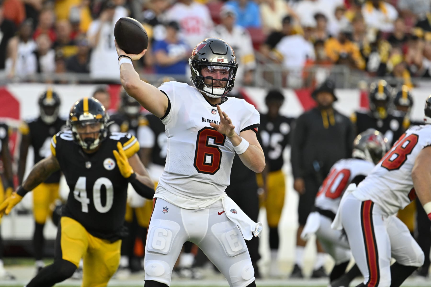 Tampa Bay Buccaneers quarterback Baker Mayfield throws a pass against the Pittsburgh Steelers during the first half of an NFL football game, Friday, Aug. 11, 2023, in Tampa, Fla. (AP Photo/Jason Behnken)