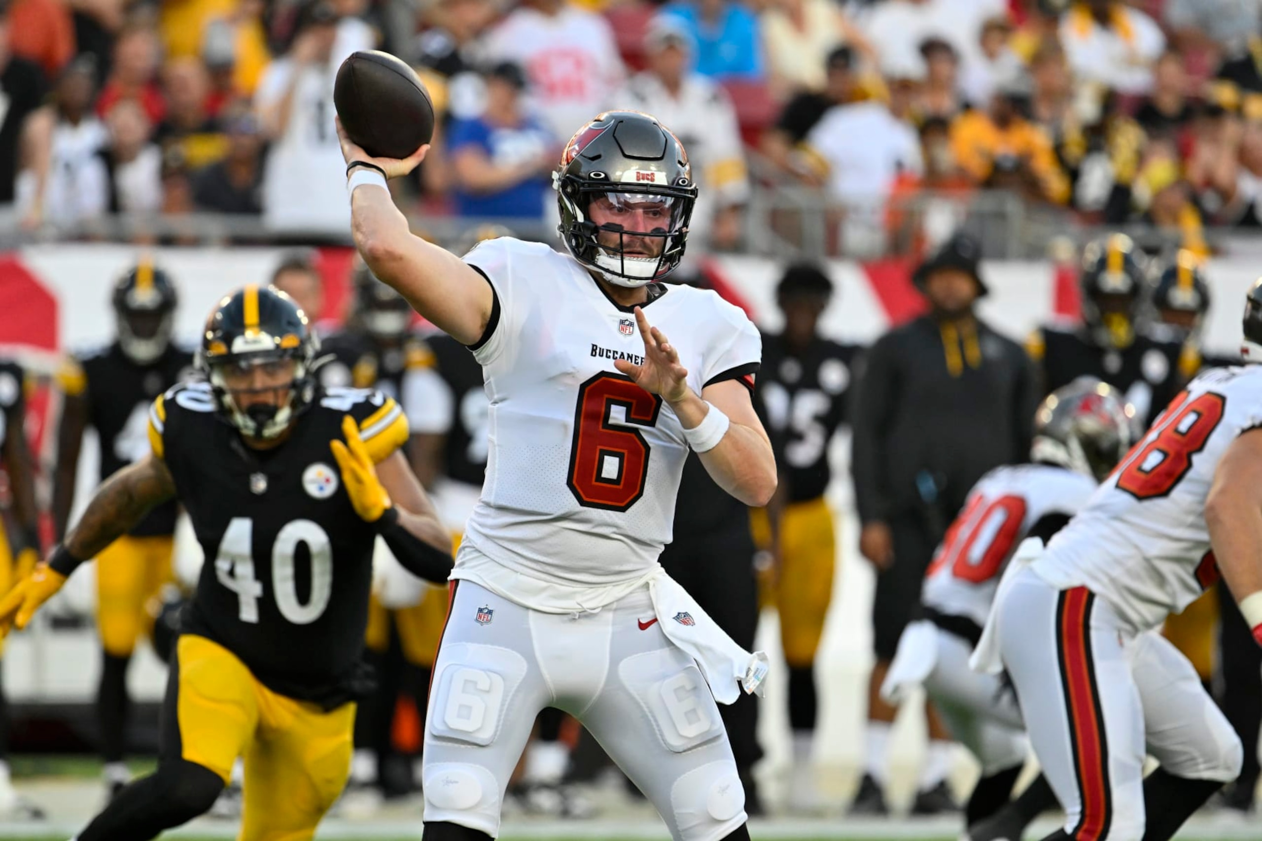 Tampa Bay Buccaneers quarterback Baker Mayfield throws a pass against the Pittsburgh Steelers during the first half of an NFL football game, Friday, Aug. 11, 2023, in Tampa, Fla. (AP Photo/Jason Behnken)