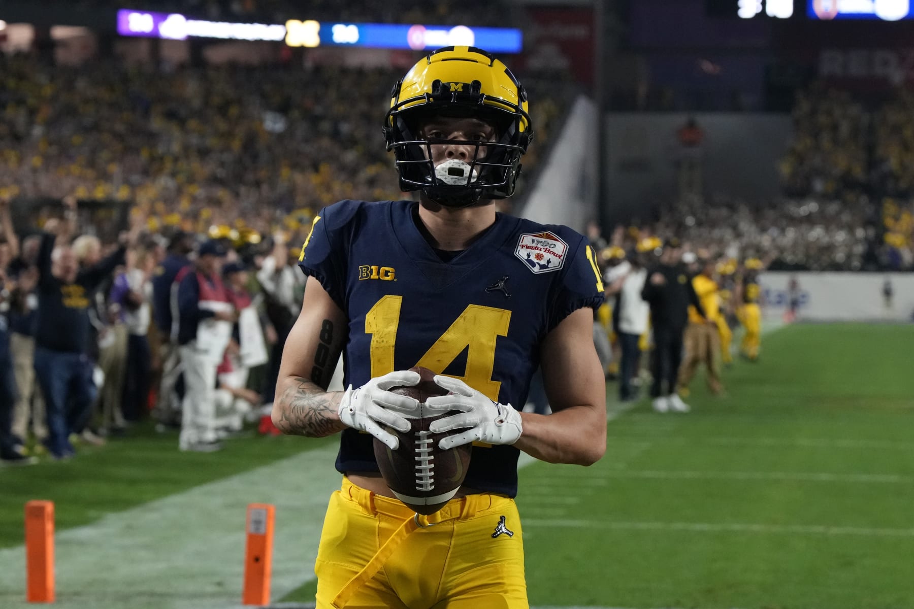 Michigan wide receiver Roman Wilson (14) during the first half of the Fiesta Bowl NCAA college football semifinal playoff game against TCU, Saturday, Dec. 31, 2022, in Glendale, Arizona. (AP Photo/Rick Scuteri)