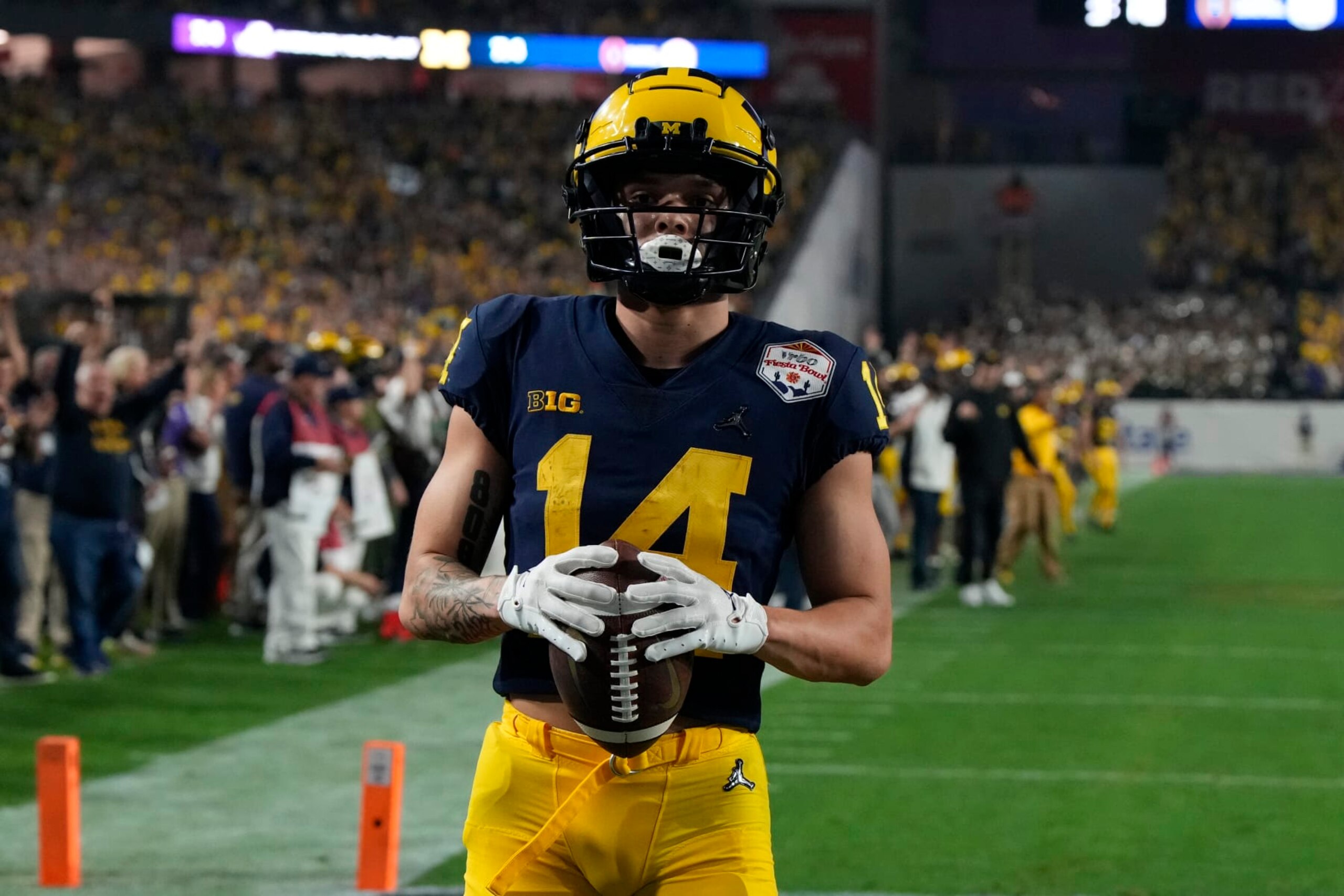 Michigan wide receiver Roman Wilson (14) during the first half of the Fiesta Bowl NCAA college football semifinal playoff game against TCU, Saturday, Dec. 31, 2022, in Glendale, Arizona. (AP Photo/Rick Scuteri)