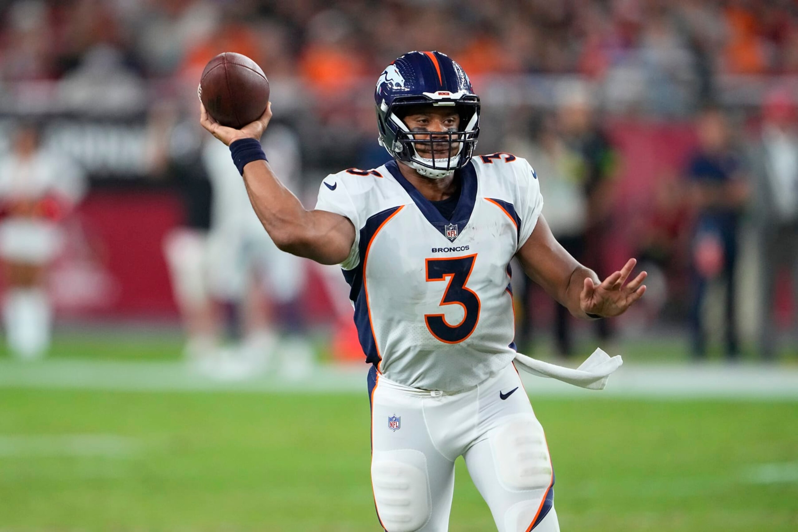 Denver Broncos quarterback Russell Wilson (3) passes against the Arizona Cardinals during the first half of an NFL preseason football game in Glendale, Ariz., Friday, Aug. 11, 2023. (AP Photo/Matt York)