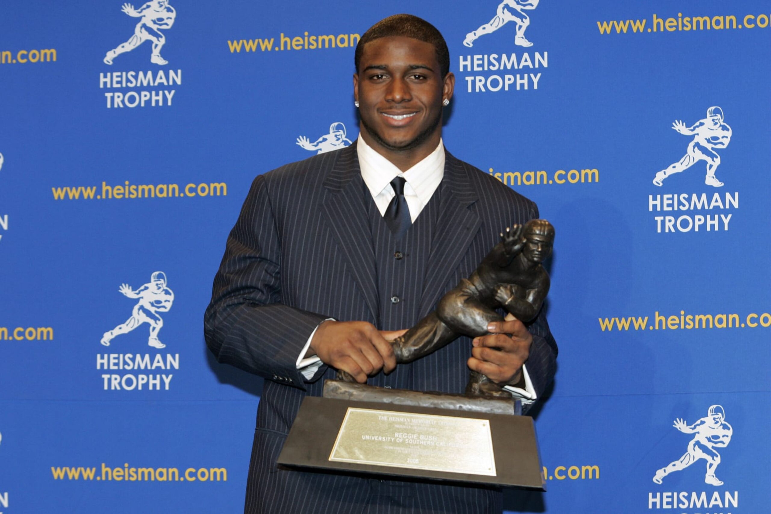 Reggie Bush, University of Southern California tailback holds  the Heisman Trophy during the 2005 Heisman Trophy presentation at the Hard Rock Cafe in New York City, New York on December 10, 2005. Bush received 2,541 points in the ballot. (Photo by Michael Cohen/WireImage)