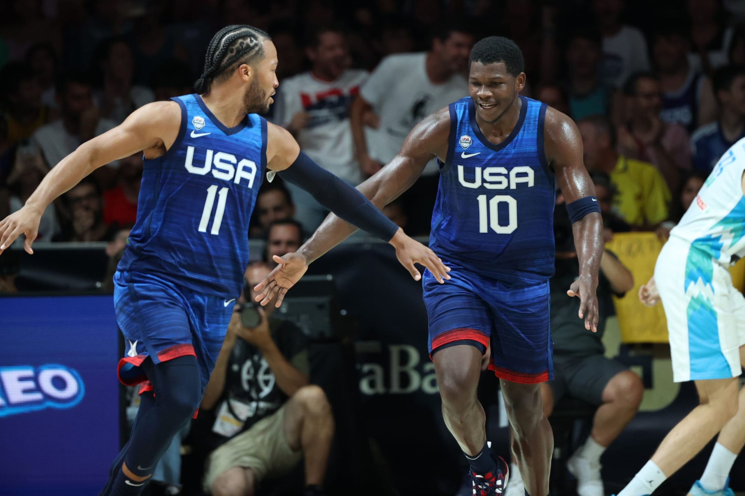 MALAGA, SPAIN - AUGUST 12: Anthony Edwards #10 of the USA Men's National Basketball Team high fives Jalen Brunson #11 of the USA Men's National Basketball Team during the game against Slovenia on August 12, 2023 at Palacio de Deportes Jose Maria Martin Carpena in Malaga, Spain. NOTE TO USER: User expressly acknowledges and agrees that, by downloading and or using this photograph, User is consenting to the terms and conditions of the Getty Images License Agreement. Mandatory Copyright Notice: Copyright 2023 NBAE (Photo by Joe Murphy/NBAE via Getty Images)