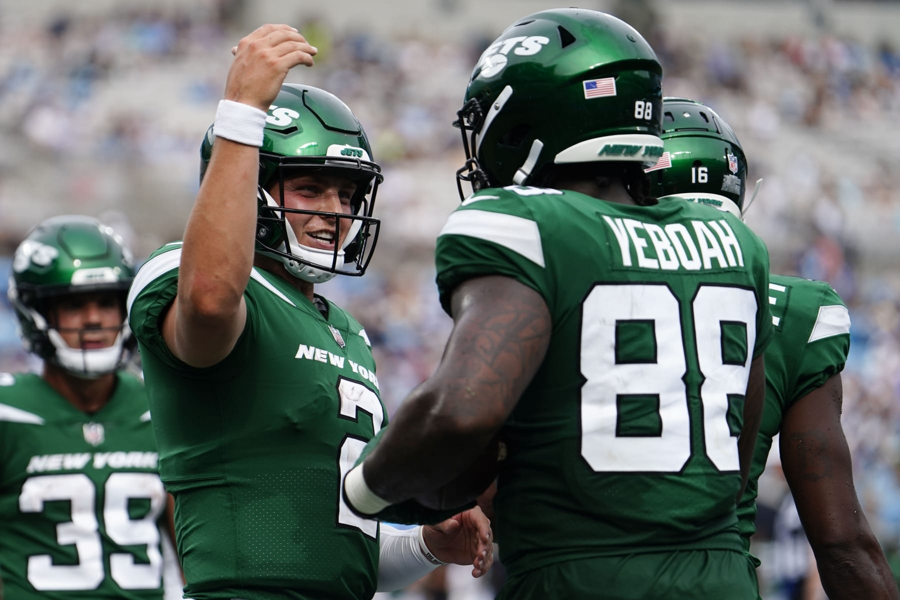 New York Jets tight end Kenny Yeboah (88) celebrates his touchdown catch with New York Jets quarterback Zach Wilson (2) during the second half of an NFL preseason football game against the Carolina Panthers, Saturday, Aug. 12, 2023, in Charlotte, N.C. The New York Jets won 27-0. (AP Photo/Jacob Kupferman)