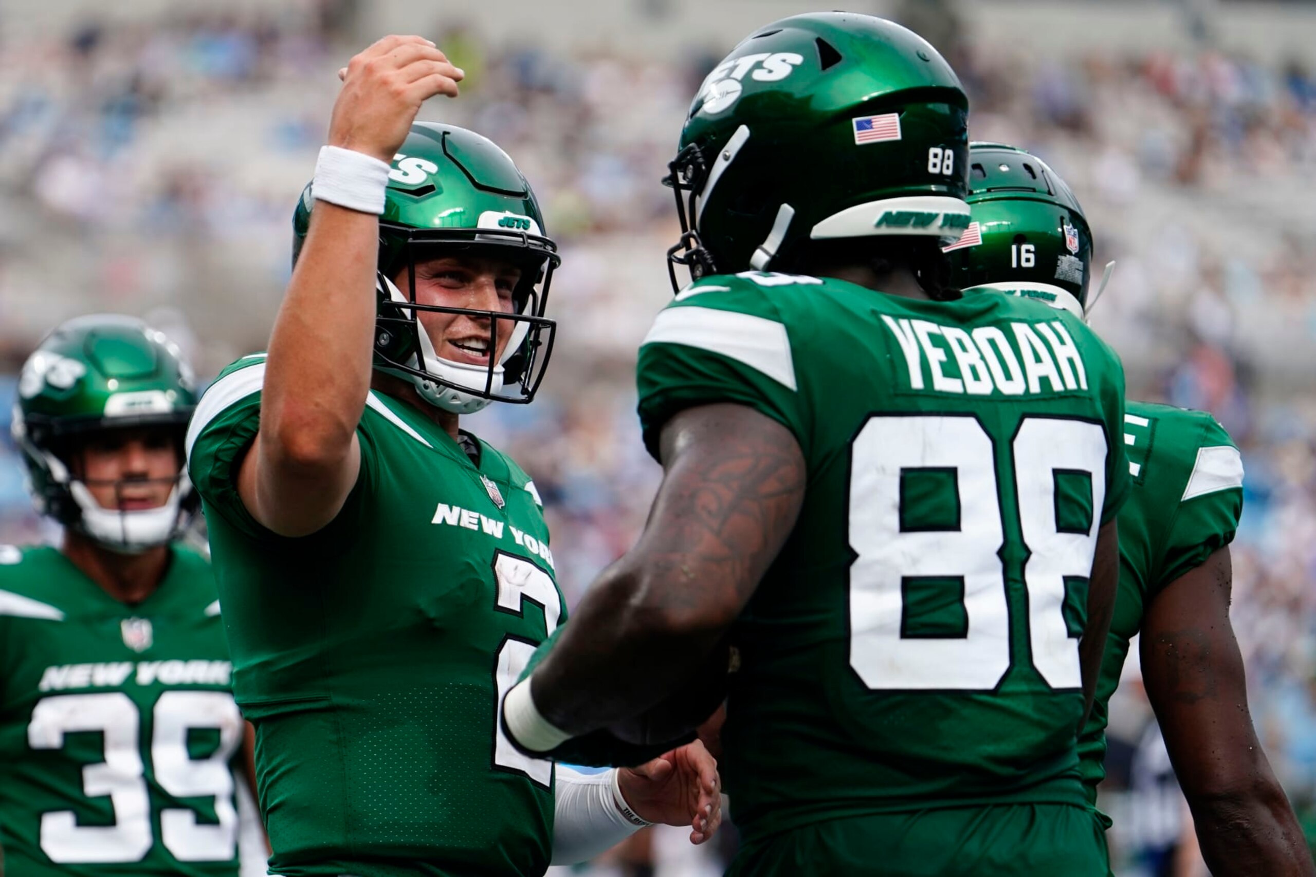 New York Jets tight end Kenny Yeboah (88) celebrates his touchdown catch with New York Jets quarterback Zach Wilson (2) during the second half of an NFL preseason football game against the Carolina Panthers, Saturday, Aug. 12, 2023, in Charlotte, N.C. The New York Jets won 27-0. (AP Photo/Jacob Kupferman)