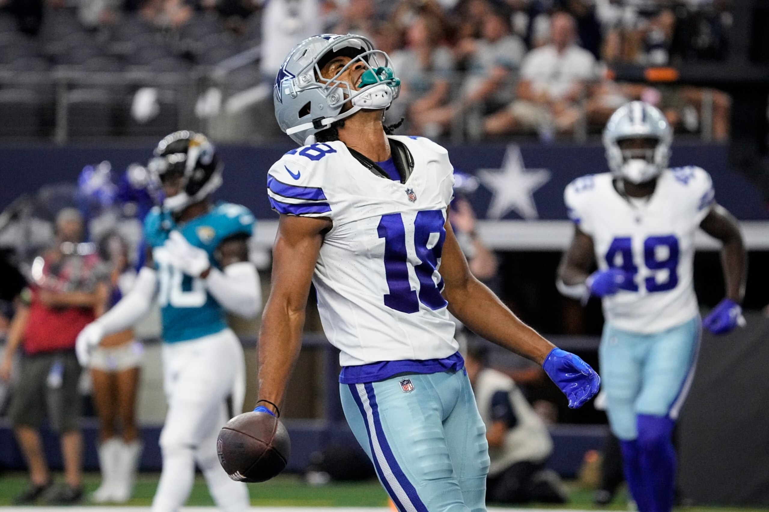 Dallas Cowboys wide receiver Jalen Tolbert (18) celebrates after making a touchdown catch during the first half of an NFL preseason football game against the Jacksonville Jaguars, Saturday, Aug. 12, 2023, in Arlington, Texas. (AP Photo/Sam Hodde)