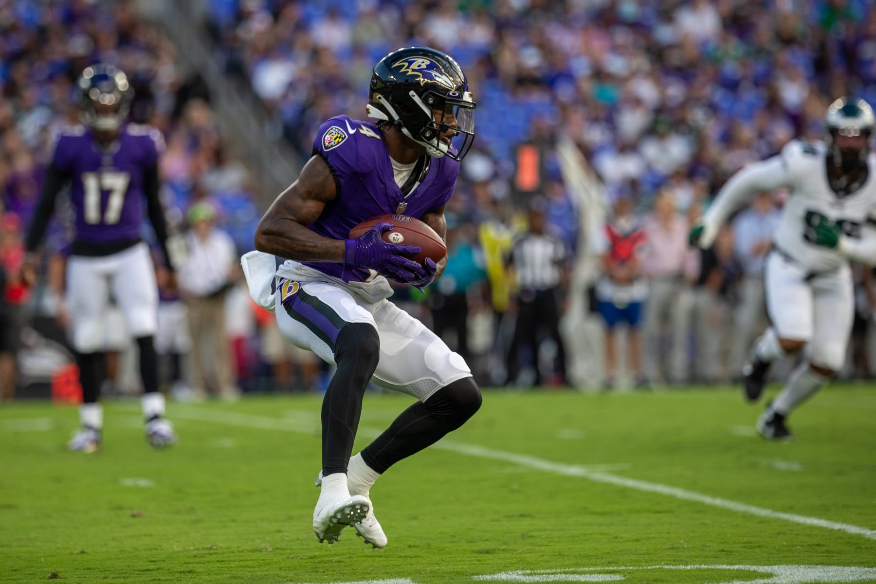 BALTIMORE, MD - AUGUST 12: Baltimore Ravens wide receiver Zay Flowers (4) looks for running space during an NFL pre-season game between the Philadelphia Eagles and the Baltimore Ravens on August 12, 2023, at M&T Bank Stadium in Baltimore, Maryland. (Photo by Charles Brock/Icon Sportswire via Getty Images)