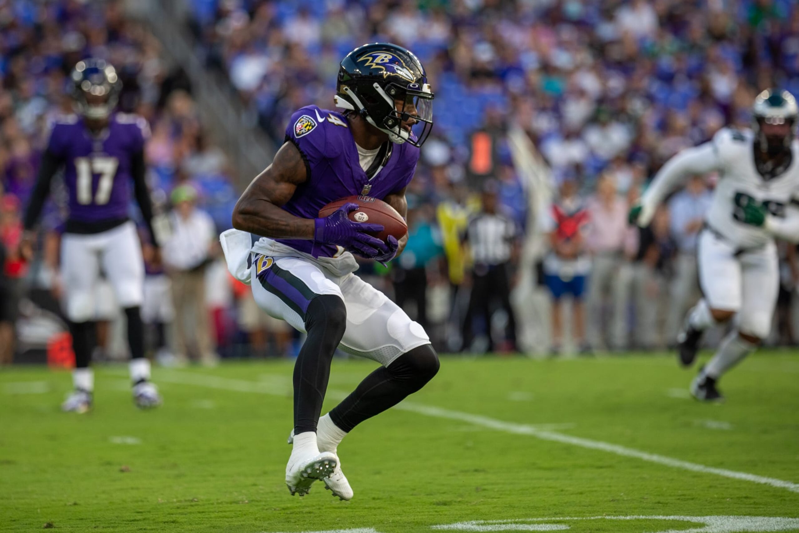 BALTIMORE, MD - AUGUST 12: Baltimore Ravens wide receiver Zay Flowers (4) looks for running space during an NFL pre-season game between the Philadelphia Eagles and the Baltimore Ravens on August 12, 2023, at M&T Bank Stadium in Baltimore, Maryland. (Photo by Charles Brock/Icon Sportswire via Getty Images)