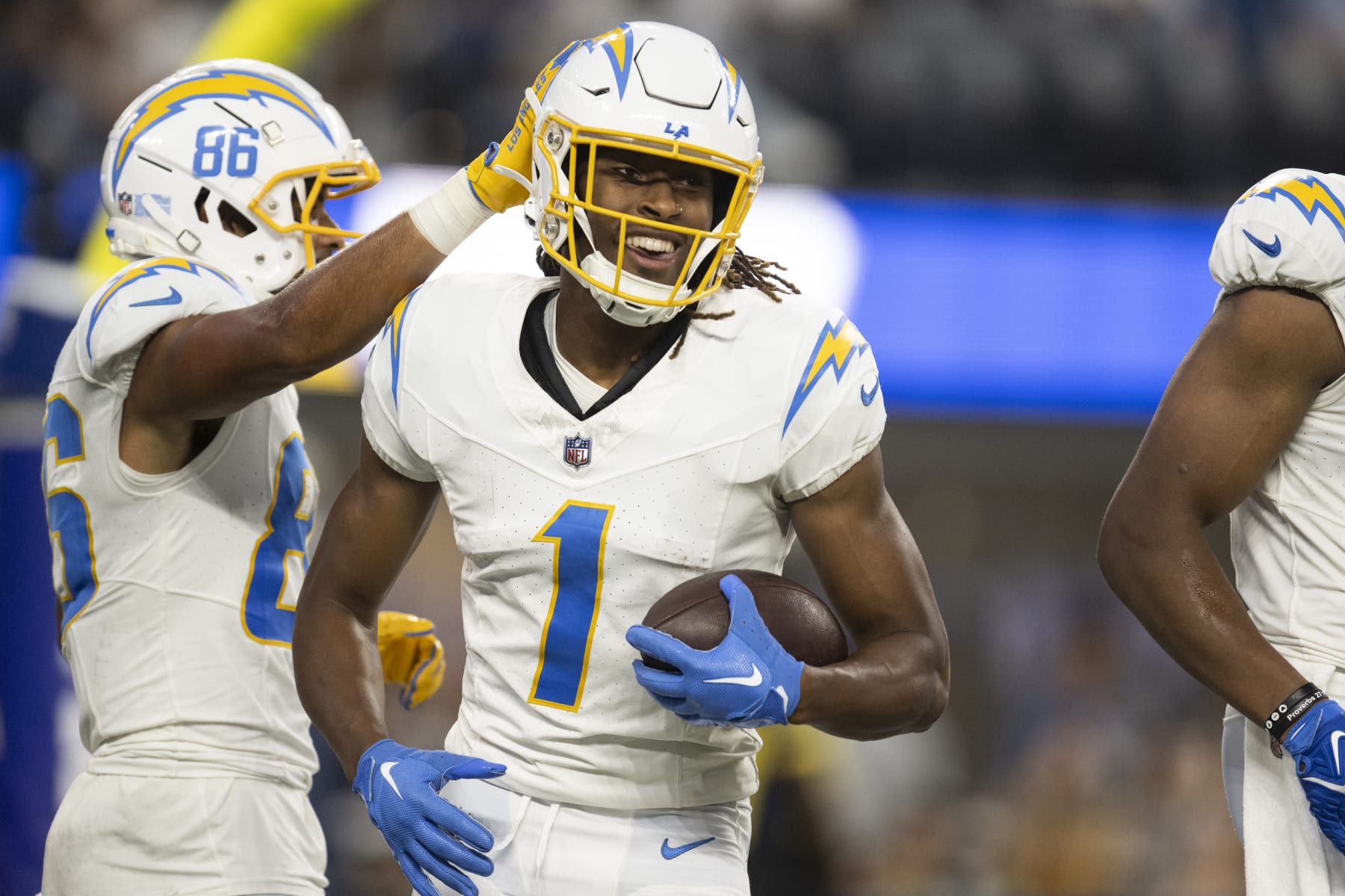 Los Angeles Chargers wide receiver Quentin Johnston (1) smiles after scoring a touchdown during the first half of an NFL preseason football game against the Los Angeles Rams, Saturday, Aug. 12, 2023, in Inglewood, Calif. (AP Photo/Kyusung Gong)