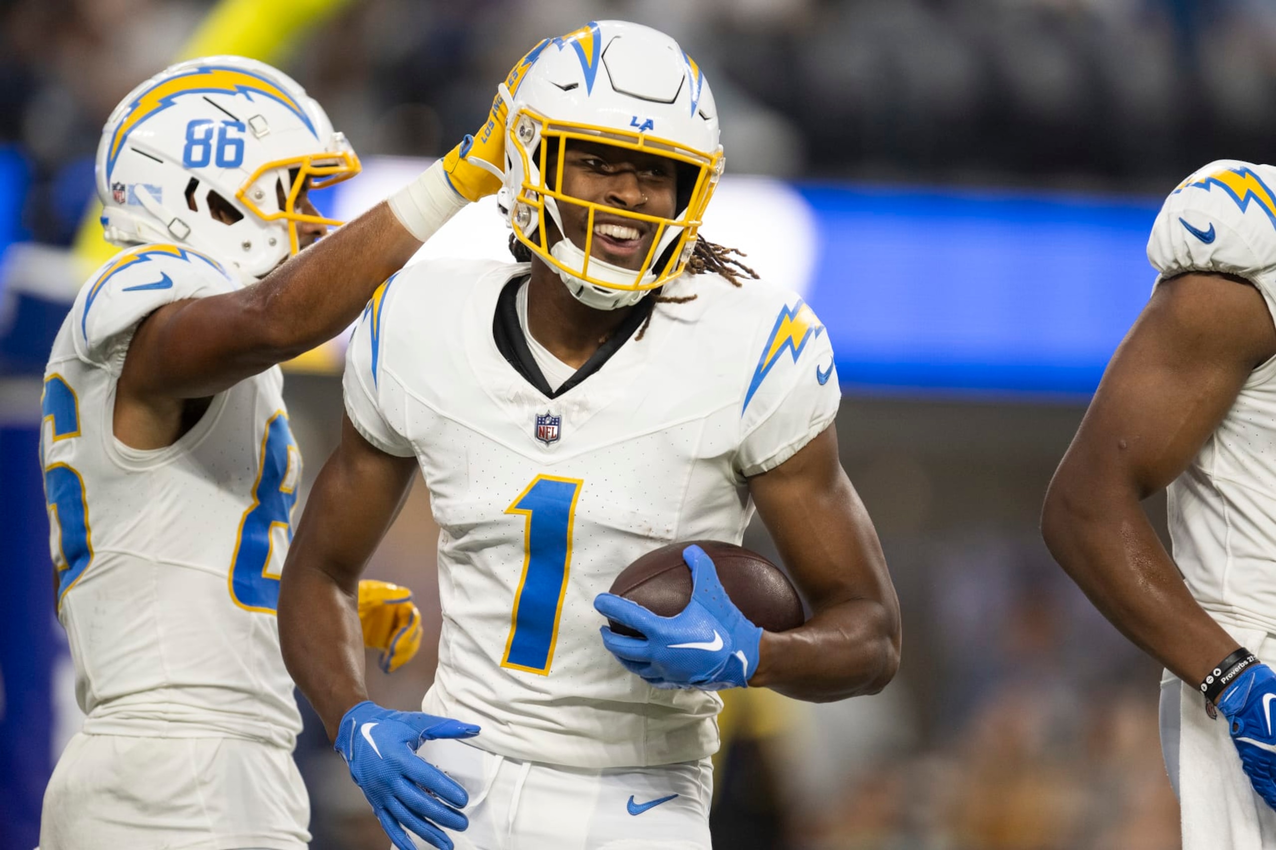 Los Angeles Chargers wide receiver Quentin Johnston (1) smiles after scoring a touchdown during the first half of an NFL preseason football game against the Los Angeles Rams, Saturday, Aug. 12, 2023, in Inglewood, Calif. (AP Photo/Kyusung Gong)