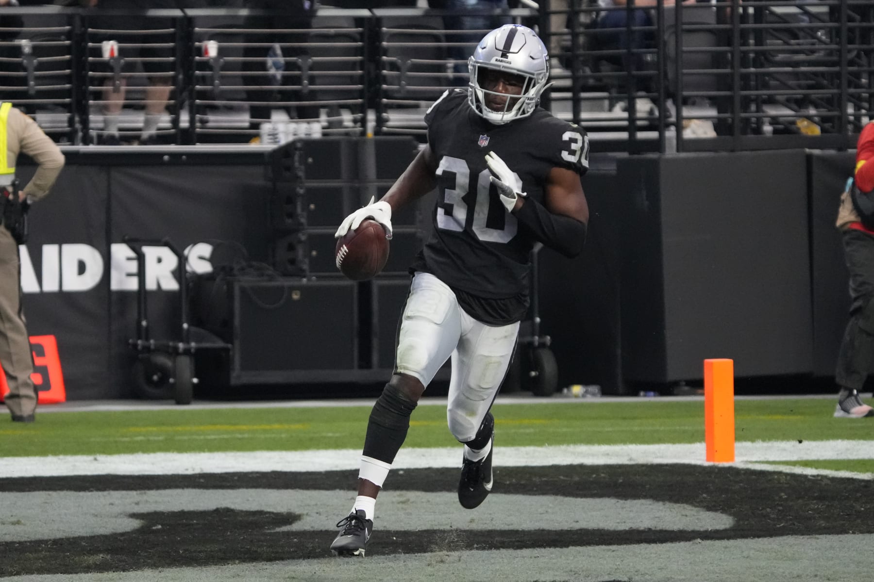 Las Vegas Raiders safety Duron Harmon (30) returns an interception for a touchdown against the Houston Texans during the first half of an NFL football game, Sunday, Oct 23, 2022, in Las Vegas. (AP Photo/Rick Scuteri)