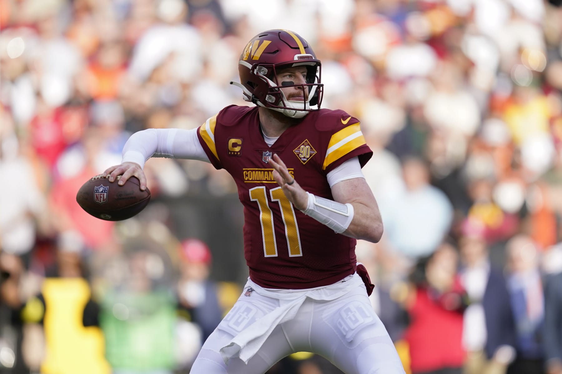 Washington Commanders quarterback Carson Wentz throws to a receiver in the first half of an NFL football game against the Cleveland Browns, Sunday, Jan. 1, 2023, in Landover, Md. (AP Photo/Patrick Semansky)