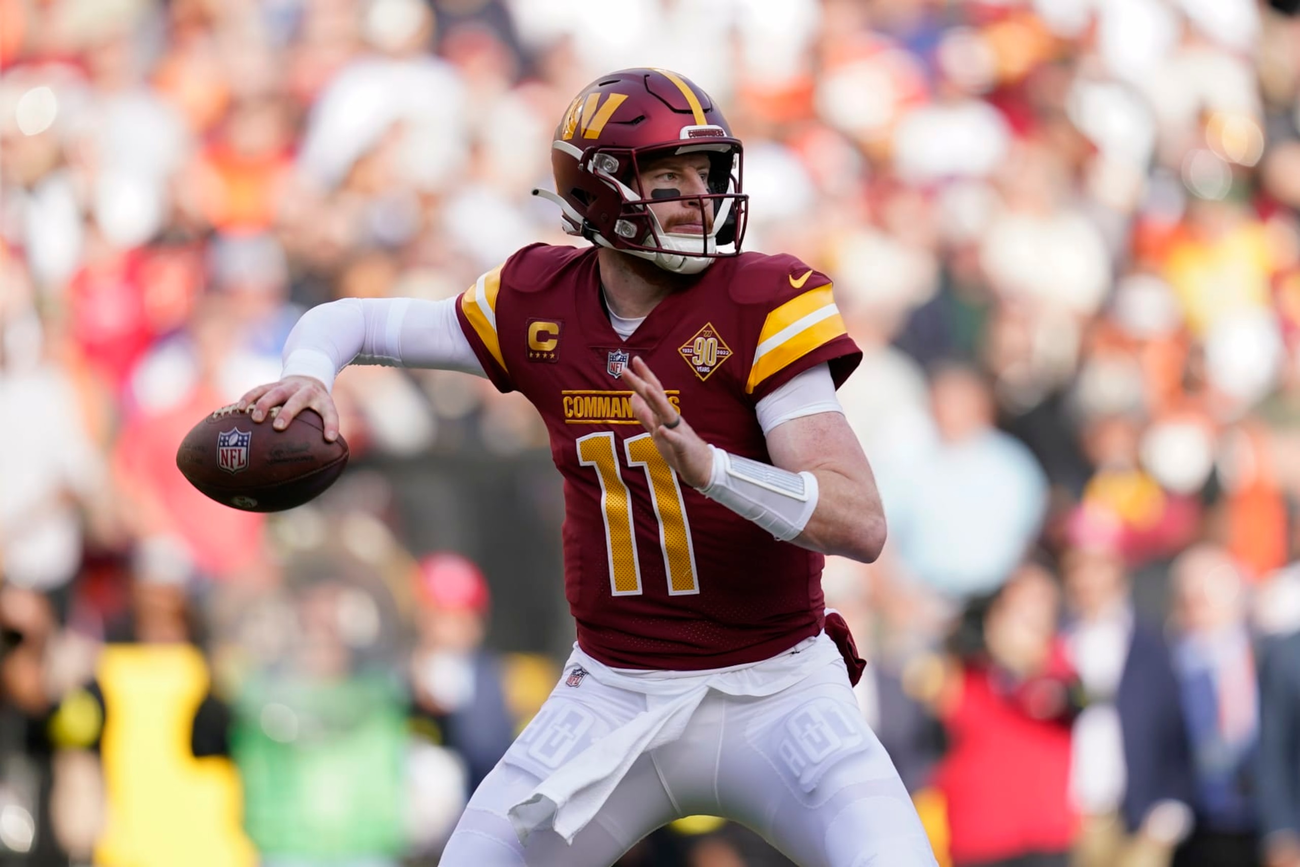 Washington Commanders quarterback Carson Wentz throws to a receiver in the first half of an NFL football game against the Cleveland Browns, Sunday, Jan. 1, 2023, in Landover, Md. (AP Photo/Patrick Semansky)