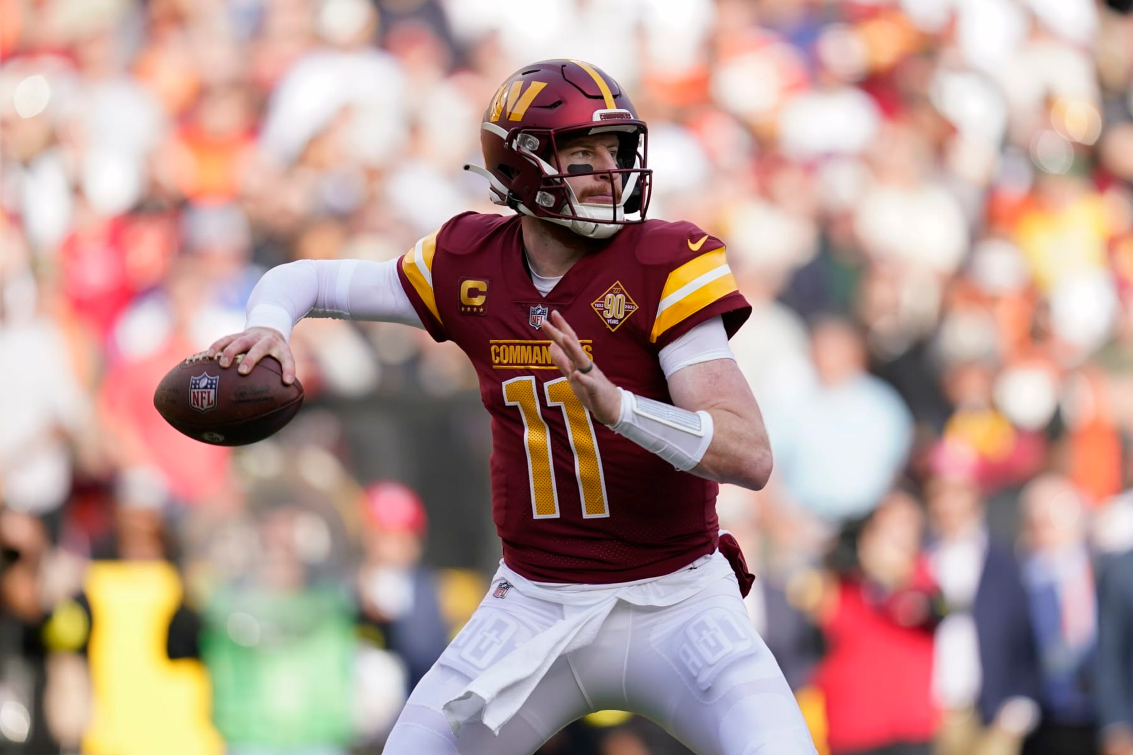 Washington Commanders quarterback Carson Wentz throws to a receiver in the first half of an NFL football game against the Cleveland Browns, Sunday, Jan. 1, 2023, in Landover, Md. (AP Photo/Patrick Semansky)