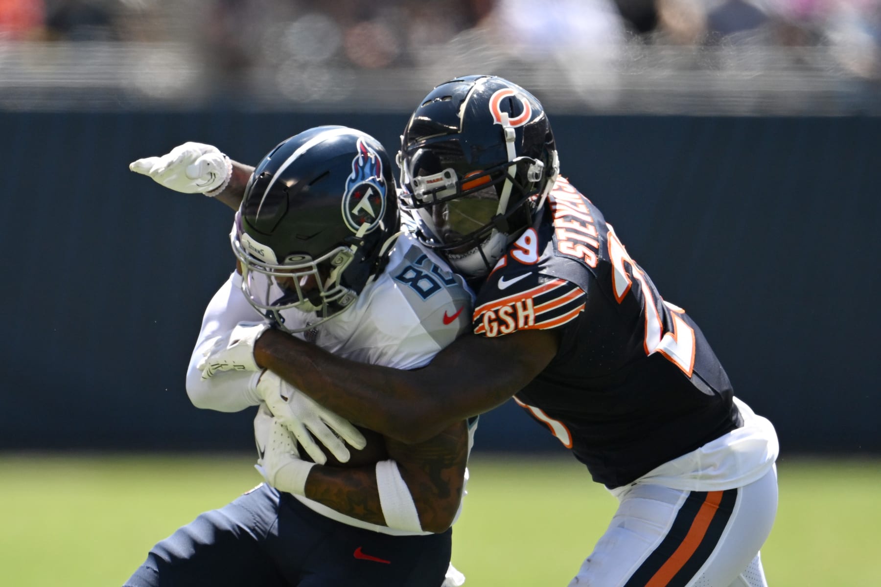 CHICAGO, ILLINOIS - AUGUST 12: Tyrique Stevenson #29 of the Chicago Bears tackles Tre'Shaun Harrison #82 of the Tennessee Titans in the second quarter during a preseason game at Soldier Field on August 12, 2023 in Chicago, Illinois. (Photo by Quinn Harris/Getty Images)