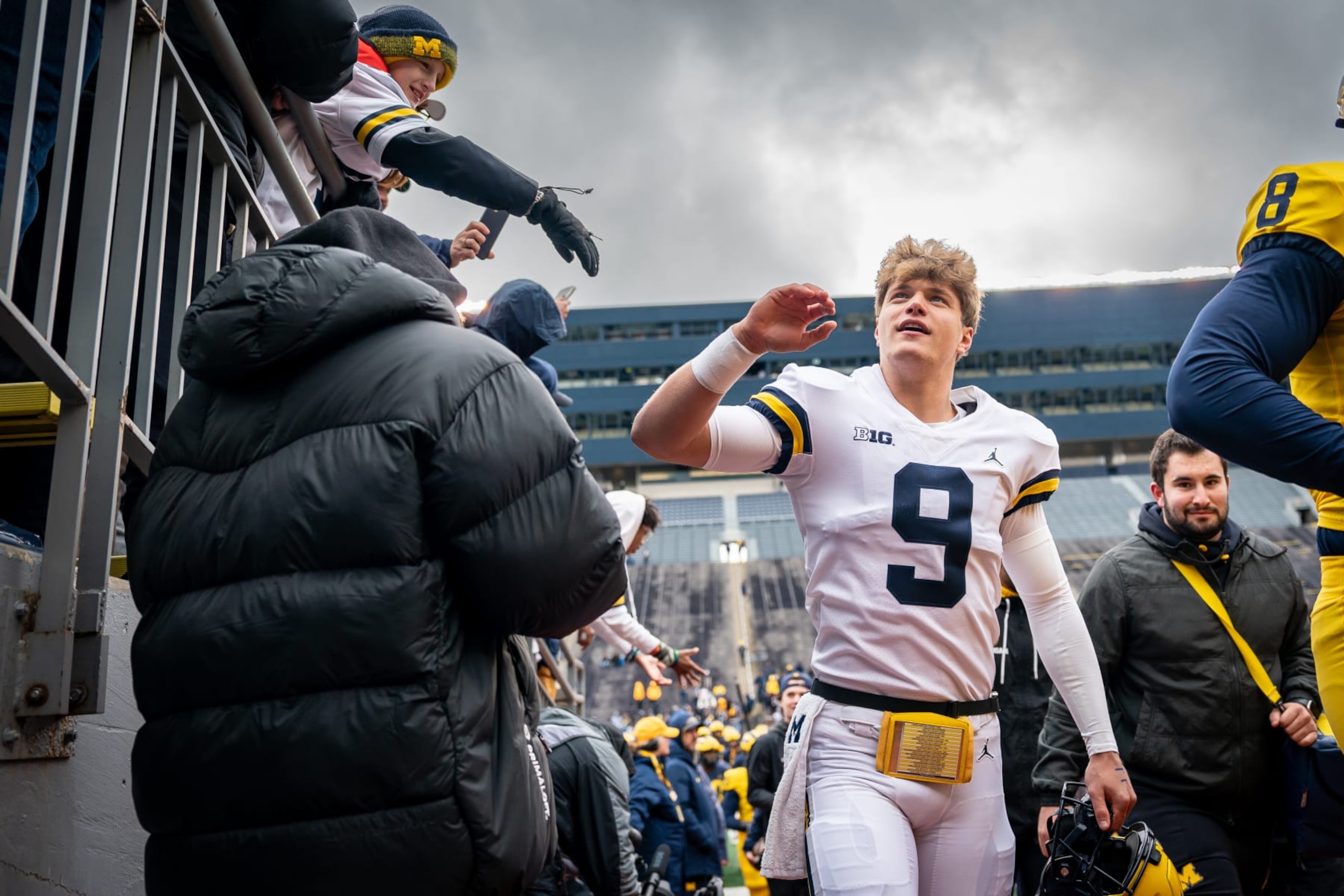ANN ARBOR, MI - APRIL 01: JJ McCarthy #9 greets fans while leaving the field at half time of the Michigan football spring game at Michigan Stadium on April 1, 2023 in Ann Arbor, Michigan. (Photo by Jaime Crawford/Getty Images)