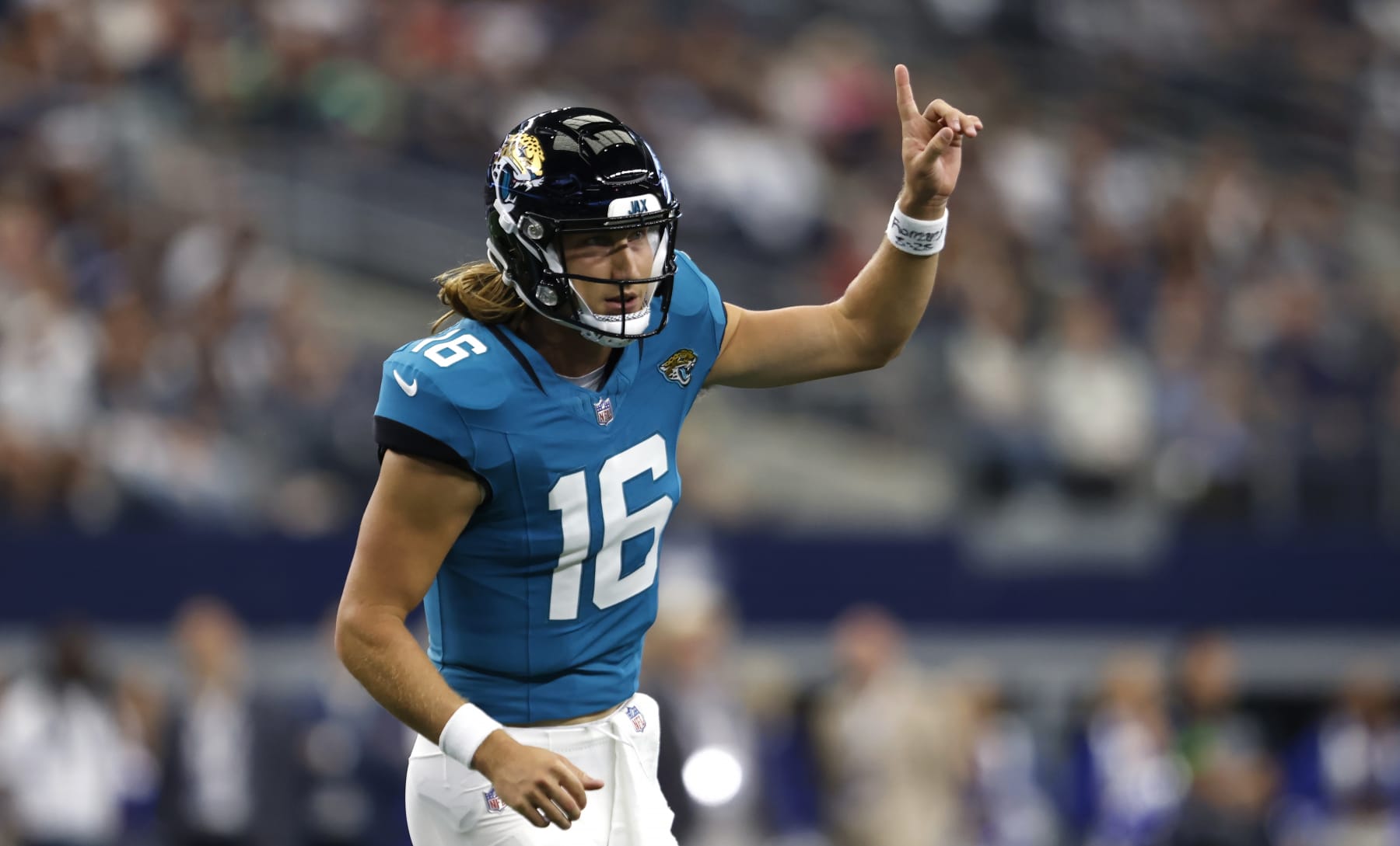 ARLINGTON, TX - AUGUST 12: Trevor Lawrence #16 of the Jacksonville Jaguars celebrates after throwing a touchdown against the Dallas Cowboys during the first half of a preseason game at AT&T Stadium on August 12, 2023 in Arlington, Texas. (Photo by Ron Jenkins/Getty Images)
