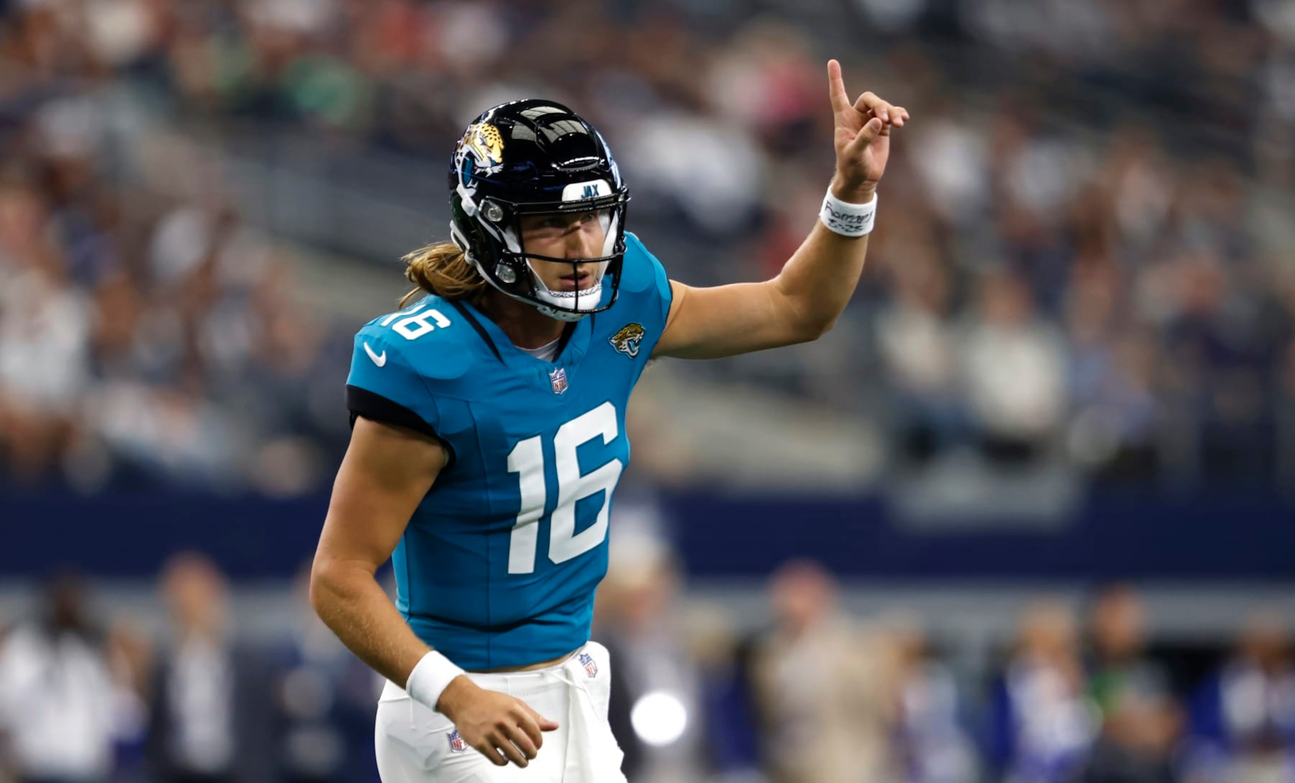 ARLINGTON, TX - AUGUST 12: Trevor Lawrence #16 of the Jacksonville Jaguars celebrates after throwing a touchdown against the Dallas Cowboys during the first half of a preseason game at AT&T Stadium on August 12, 2023 in Arlington, Texas. (Photo by Ron Jenkins/Getty Images)