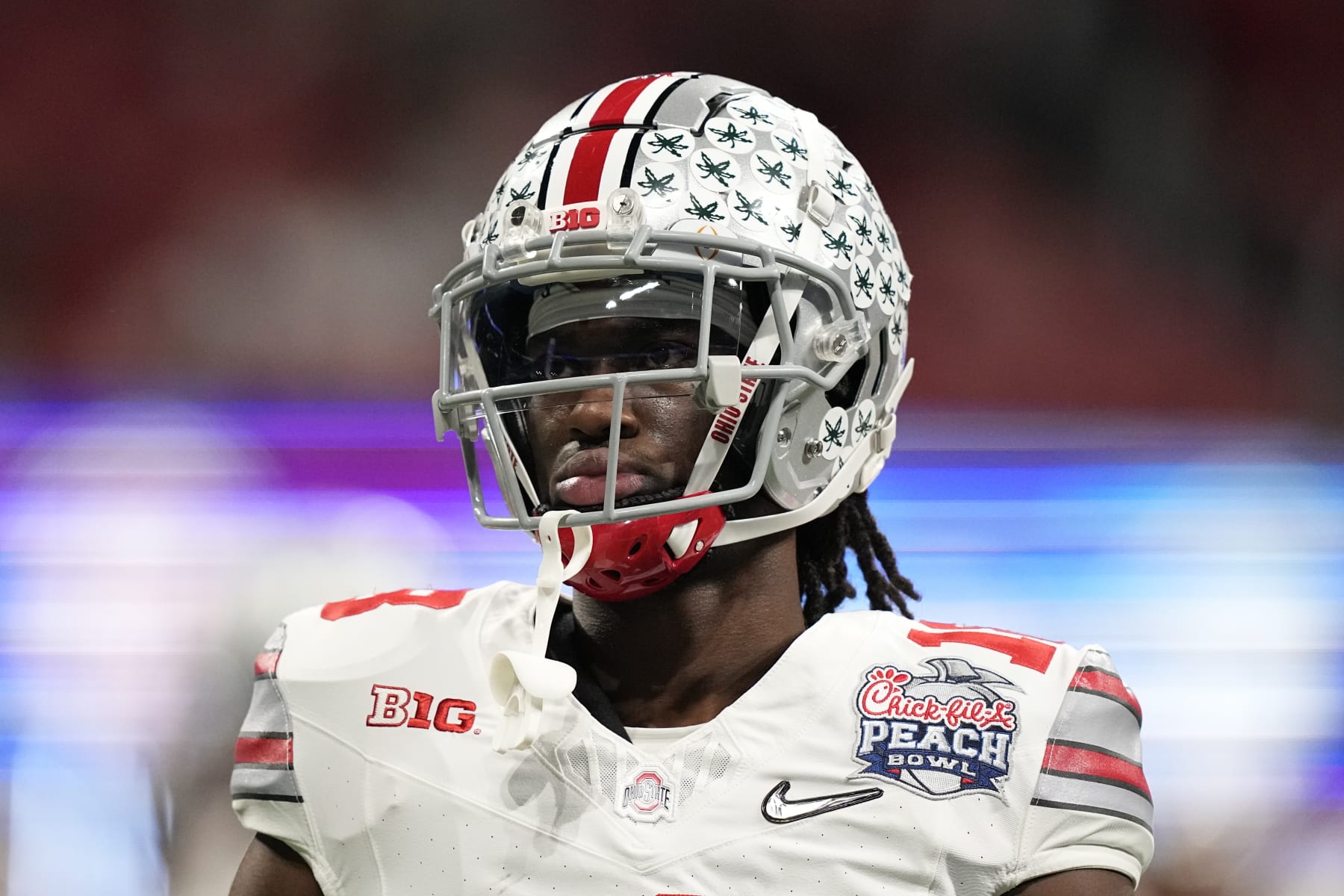 Ohio State wide receiver Marvin Harrison Jr. (18) warms up before the Peach Bowl NCAA college football semifinal playoff game between Georgia and Ohio State, Saturday, Dec. 31, 2022, in Atlanta. (AP Photo/Brynn Anderson)