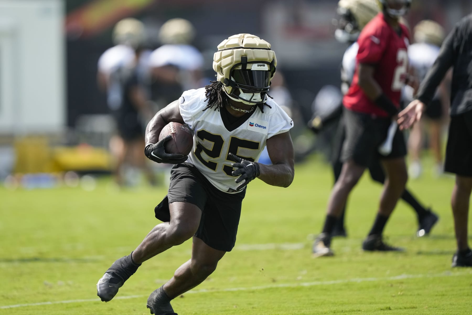 New Orleans Saints running back Kendre Miller (25) runs through drills at the team's NFL football training camp in Metairie, La., Wednesday, July 26, 2023. (AP Photo/Gerald Herbert)