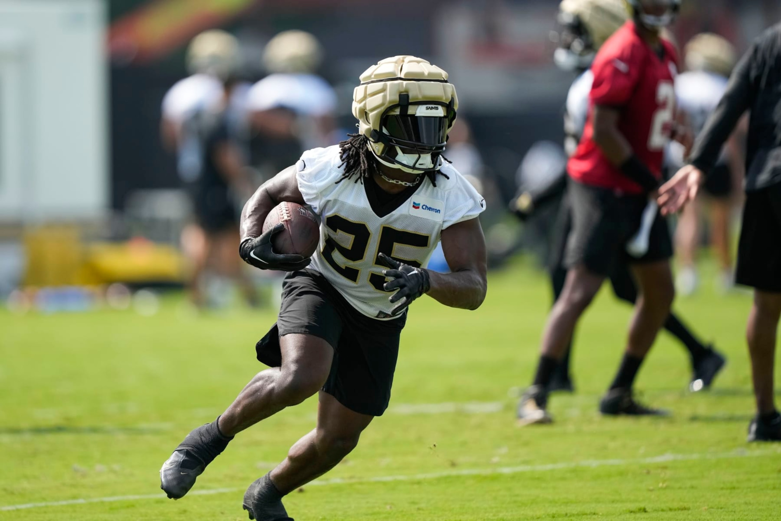 New Orleans Saints running back Kendre Miller (25) runs through drills at the team's NFL football training camp in Metairie, La., Wednesday, July 26, 2023. (AP Photo/Gerald Herbert)