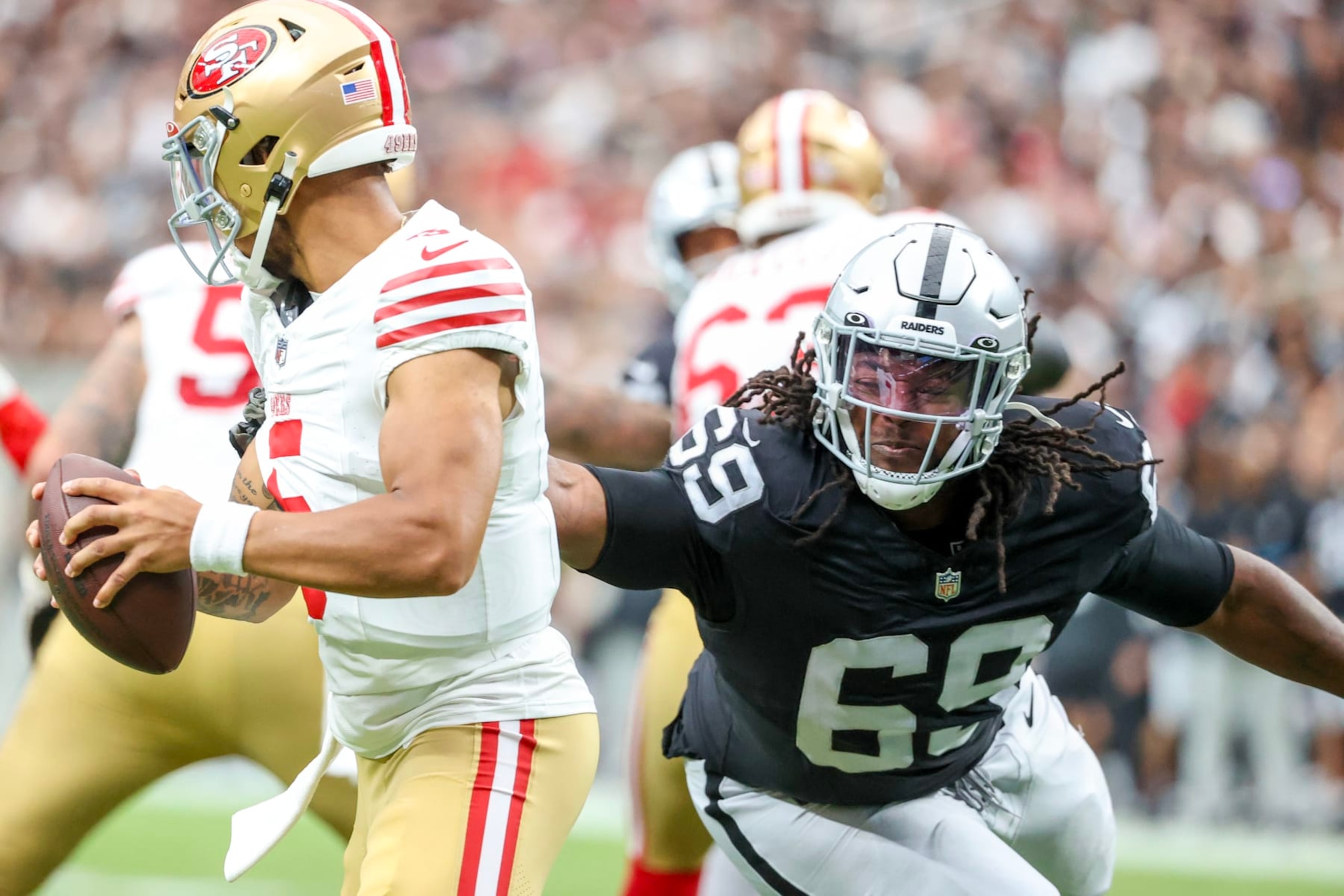 Raiders DT Adam Butler pressures Trey Lance
