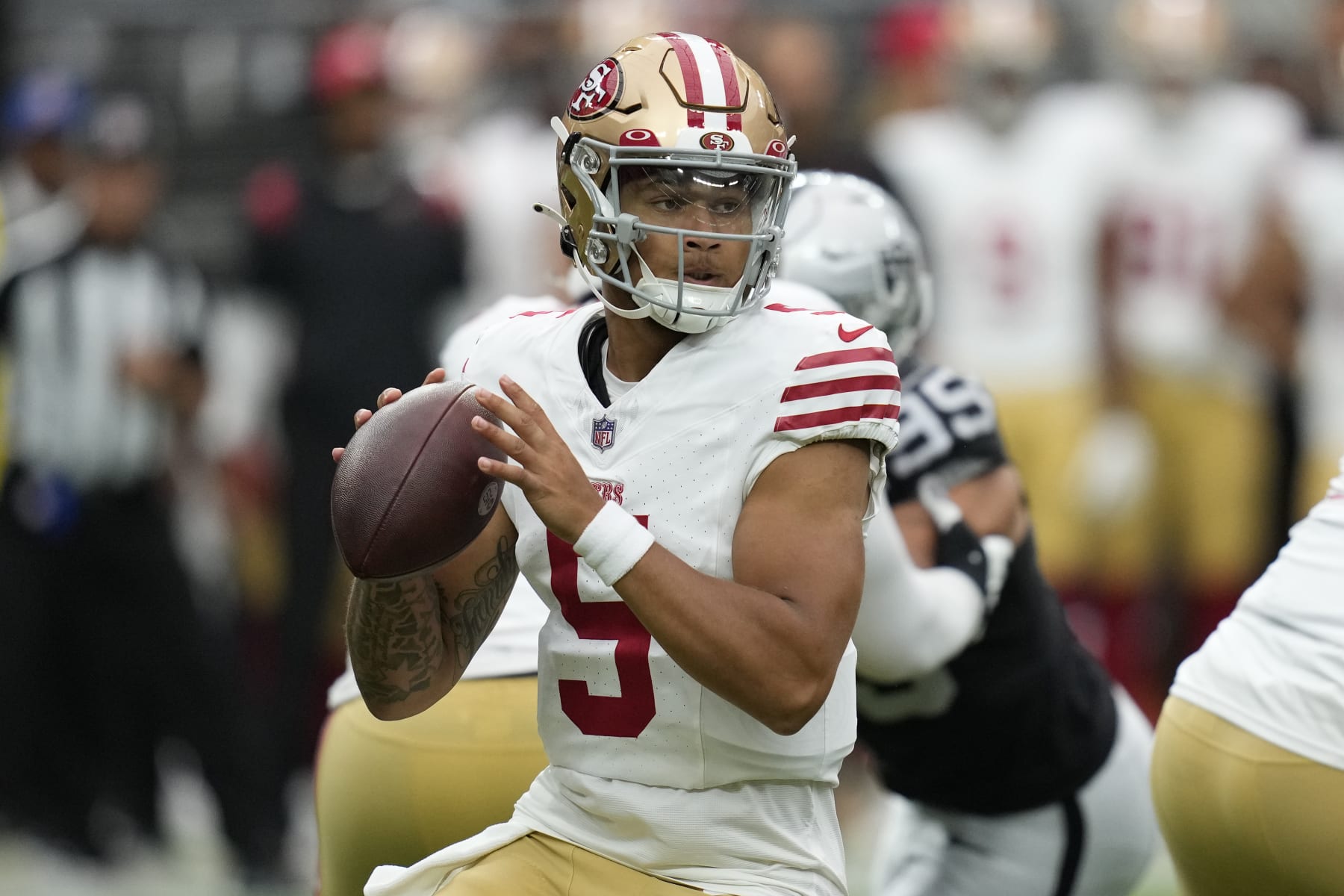 San Francisco 49ers quarterback Trey Lance (5) drops back to throw against the Las Vegas Raiders during the first half of an NFL preseason football game, Sunday, Aug. 13, 2023, in Las Vegas. (AP Photo/John Locher)