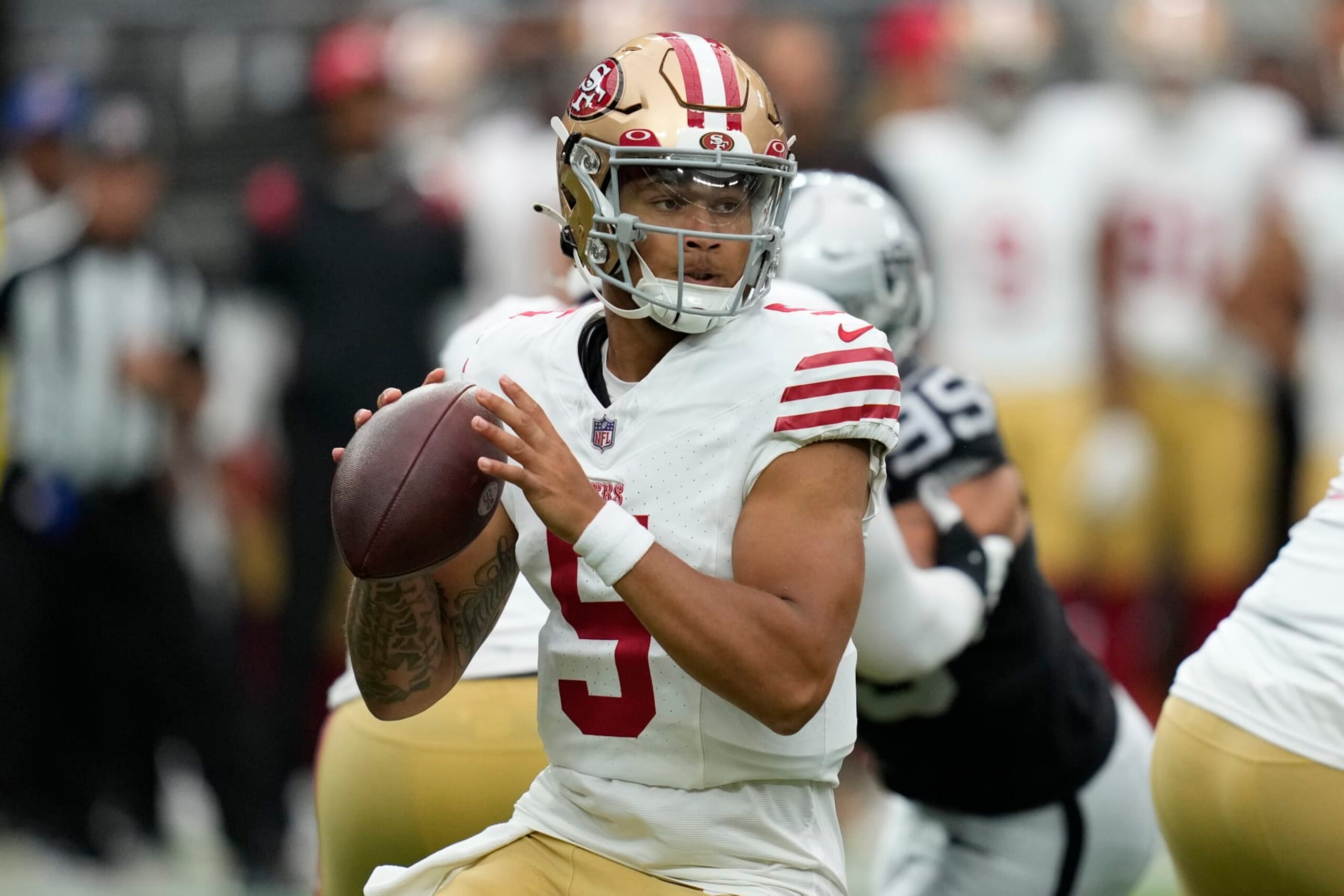 San Francisco 49ers quarterback Trey Lance (5) drops back to throw against the Las Vegas Raiders during the first half of an NFL preseason football game, Sunday, Aug. 13, 2023, in Las Vegas. (AP Photo/John Locher)
