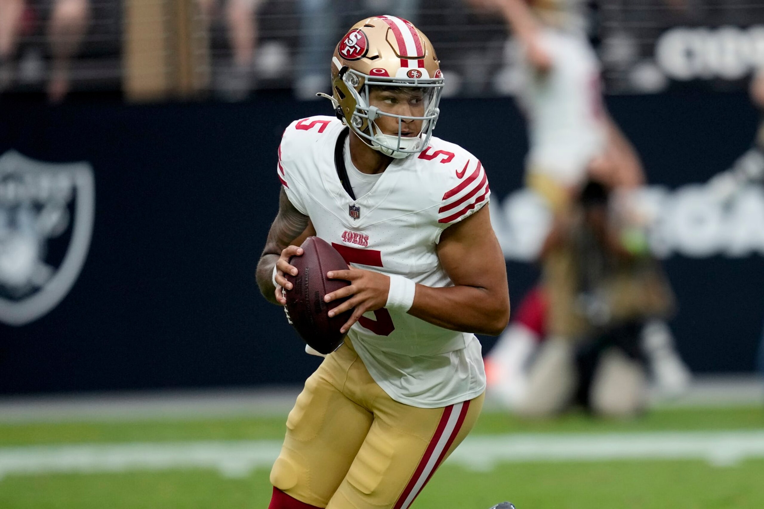 San Francisco 49ers quarterback Trey Lance (5) drops backs to pass against the Las Vegas Raiders during the first half of an NFL preseason football game, Sunday, Aug. 13, 2023, in Las Vegas. (AP Photo/John Locher)