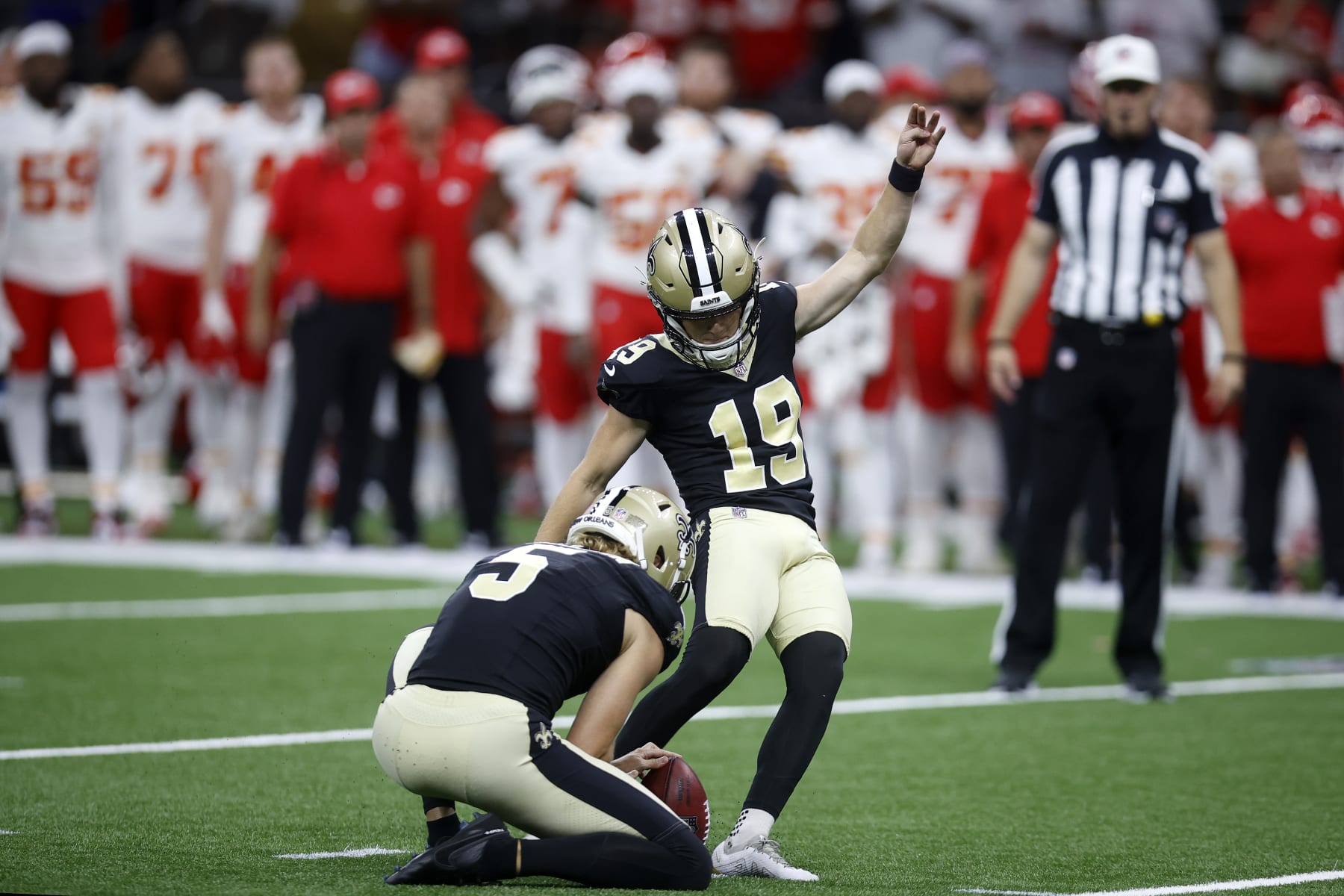 NEW ORLEANS, LOUISIANA - AUGUST 13: Blake Grupe #19 of the New Orleans Saints kicks a game-winning field goal during a preseason game against the Kansas City Chiefs at Caesars Superdome on August 13, 2023 in New Orleans, Louisiana. (Photo by Chris Graythen/Getty Images)