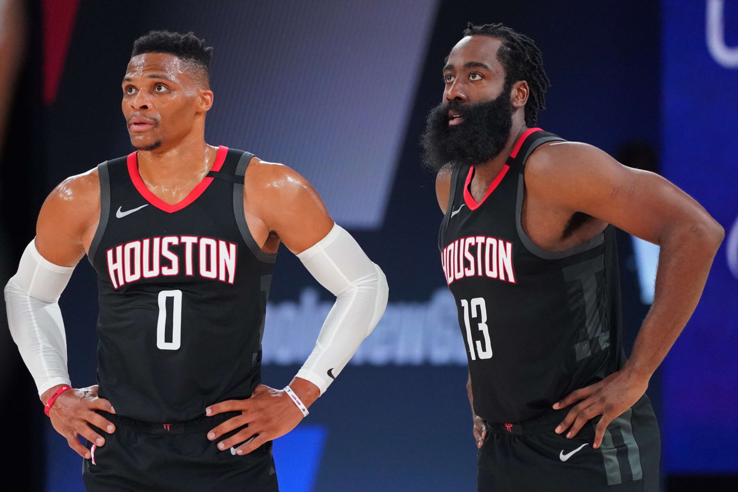 ORLANDO, FL - SEPTEMBER 8: Russell Westbrook #0 and James Harden #13 of the Houston Rockets looks on during Round Two, Game Three of the Western Conference Semifinals on September 8, 2020 at the AdventHealth Arena at ESPN Wide World Of Sports Complex in Orlando, Florida. NOTE TO USER: User expressly acknowledges and agrees that, by downloading and/or using this Photograph, user is consenting to the terms and conditions of the Getty Images License Agreement. Mandatory Copyright Notice: Copyright 2020 NBAE (Photo by Jesse D. Garrabrant/NBAE via Getty Images)