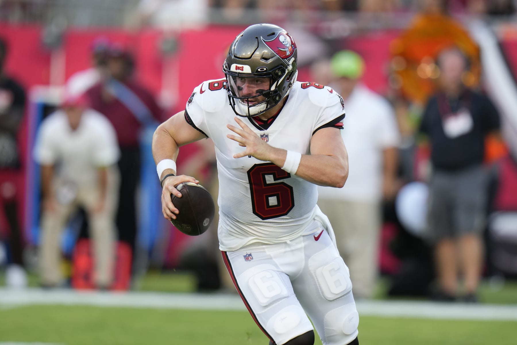 Tampa Bay Buccaneers quarterback Baker Mayfield scrambles against the Pittsburgh Steelers during the first half of an NFL preseason football game Friday, Aug. 11, 2023, in Tampa, Fla. (AP Photo/Chris O'Meara)