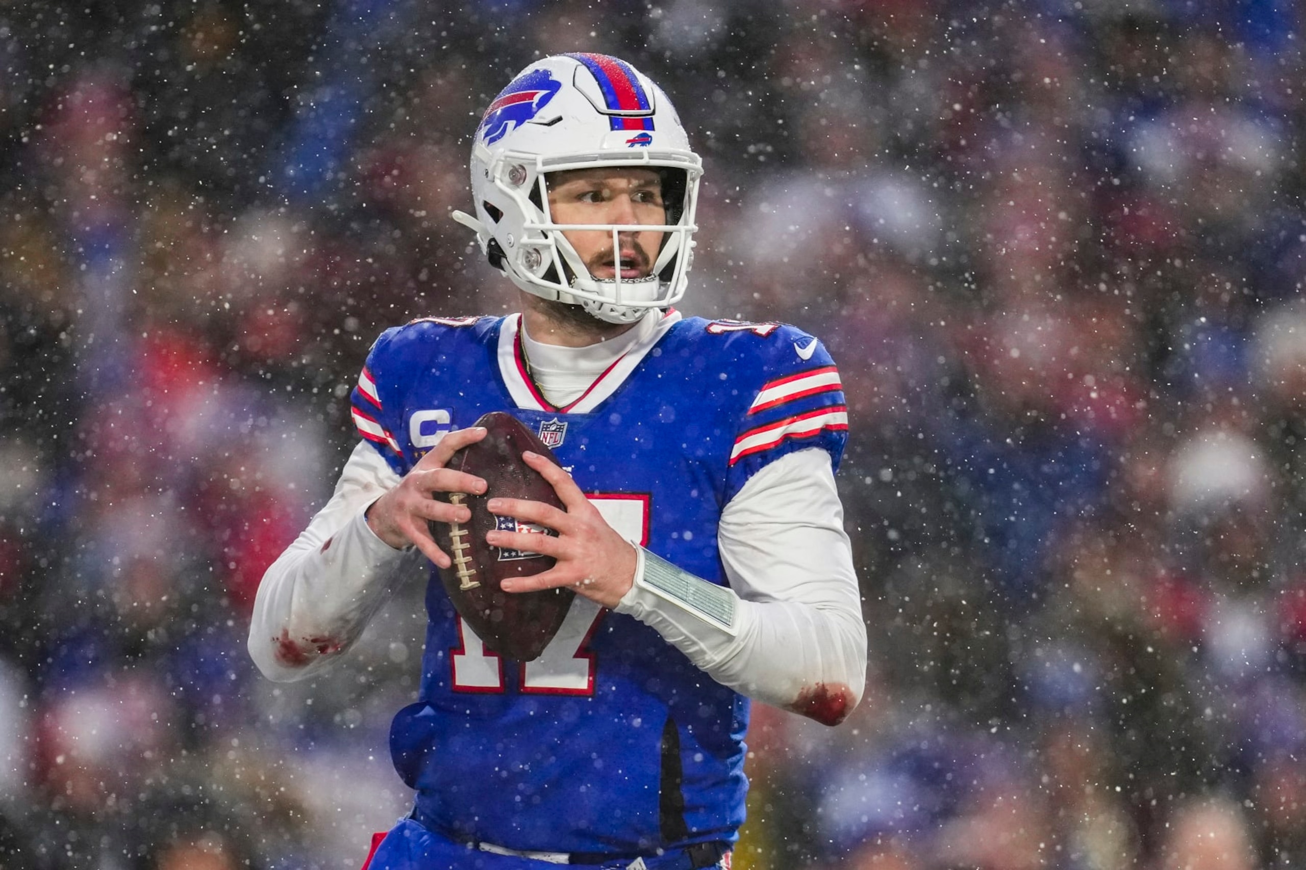 ORCHARD PARK, NY - JANUARY 22: Josh Allen #17 of the Buffalo Bills looks to pass against the Cincinnati Bengals at Highmark Stadium on January 22, 2023 in Orchard Park, New York. (Photo by Cooper Neill/Getty Images)