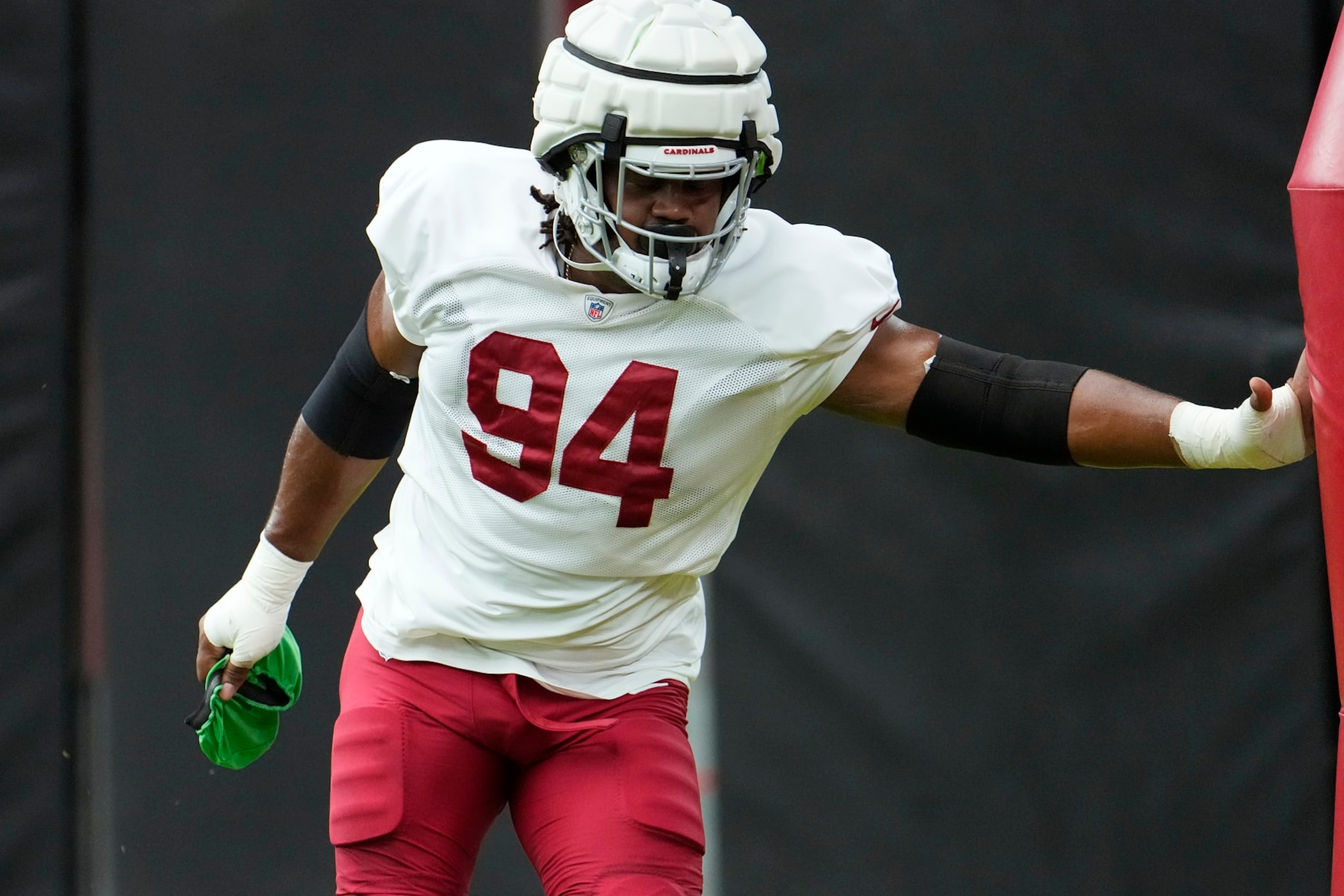 Arizona Cardinals defensive tackle Carlos Watkins pauses during NFL football training camp practice at State Farm Stadium Thursday, Aug. 3, 2023, in Glendale, Ariz. (AP Photo/Ross D. Franklin)
